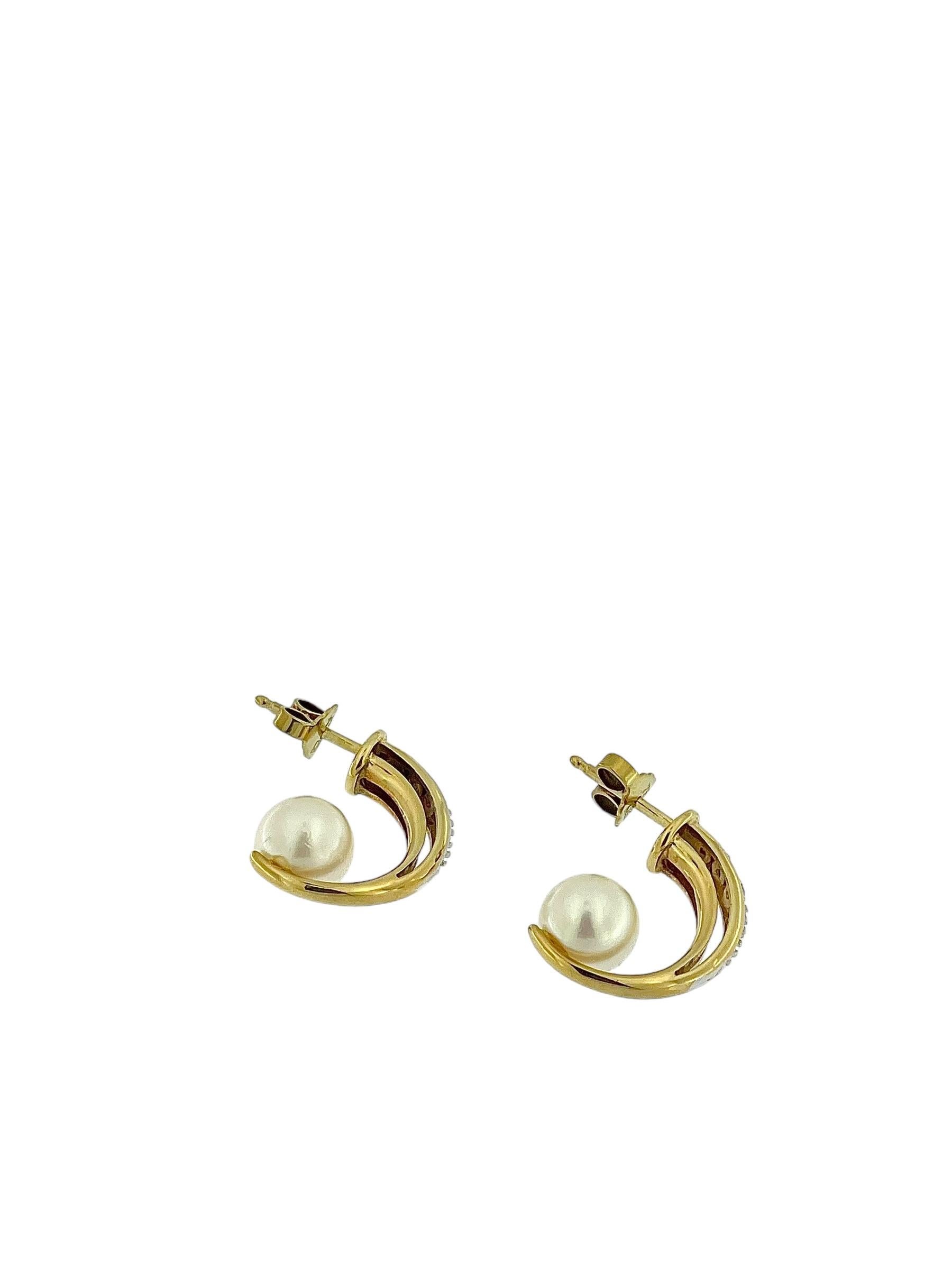 The Modern German Gold Earrings with Pearls and Diamonds by JKa are a stunning fusion of contemporary design and classic elegance. Crafted from a combination of 18kt yellow and white gold, these earrings are a testament to exceptional German