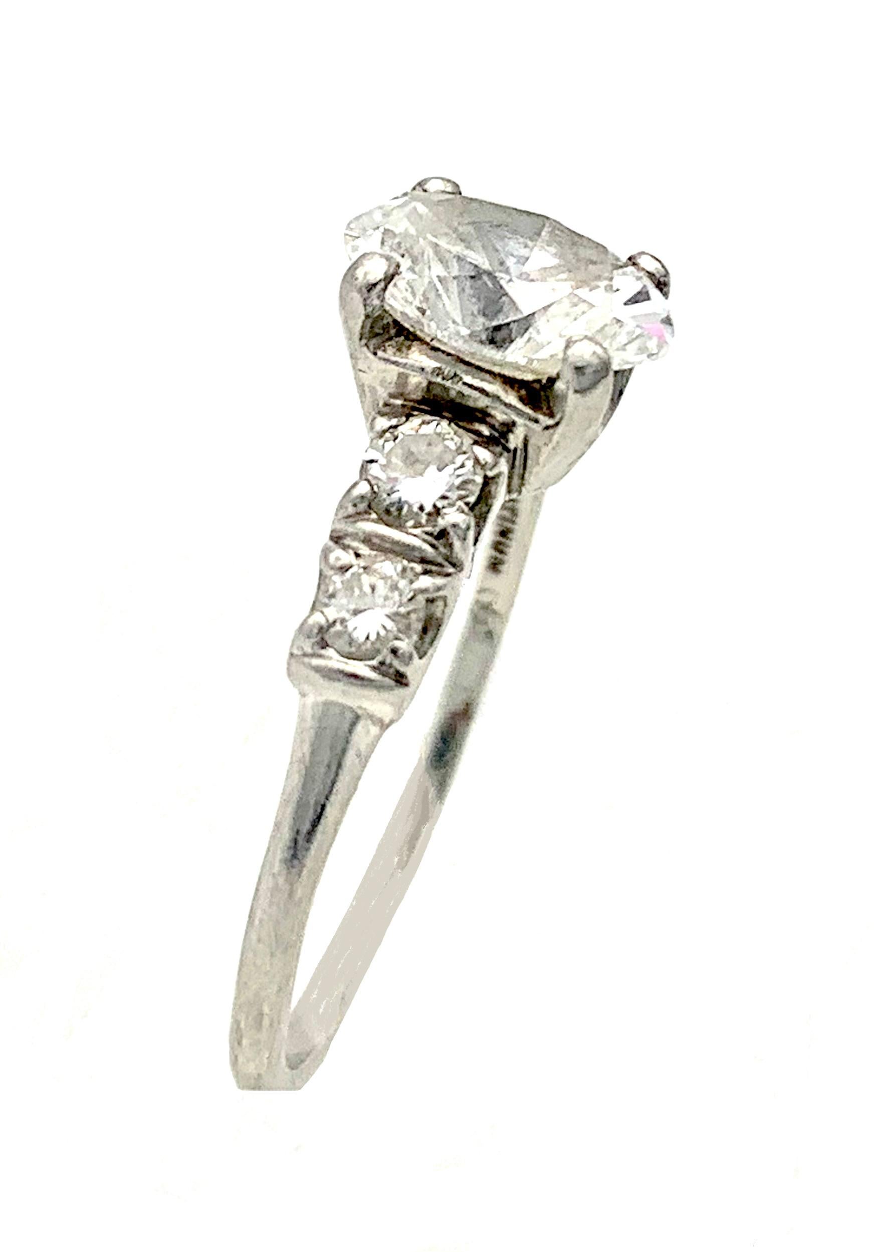 This elegant modern diamond ring Is accompanied by a G.I.A. from 2006 certificate stating that the oval brilliant cut diamond has the established weight of 1.11 carat. The colour of the diamond is E and the clarity VVS2. The oval diamond is mounted