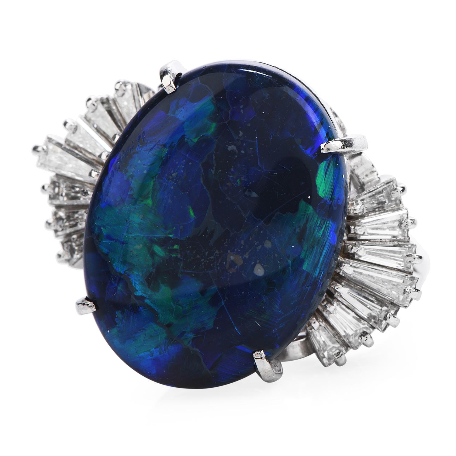 The Have the Beauty of the Universe, right in your finger!

This stunning  Black Opal & Diamond Cocktail ring is crafted in Solid Platinum,

weighing 12.3 grams and the top measures 25 mm x 20 mm, 12 mm high.

Showcasing a prominent four-prong set