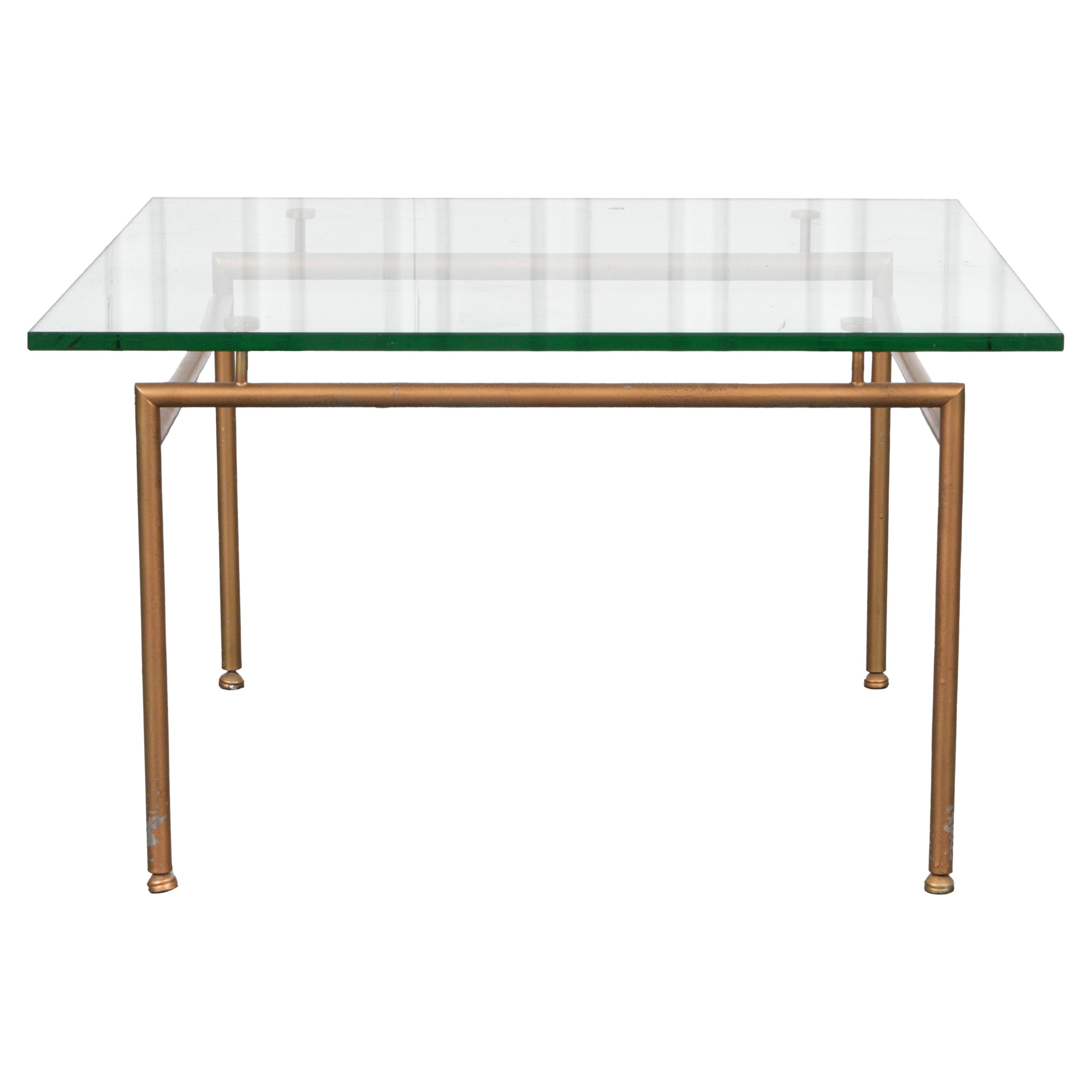 Moderner moderner Tisch aus vergoldetem Metall und Glas