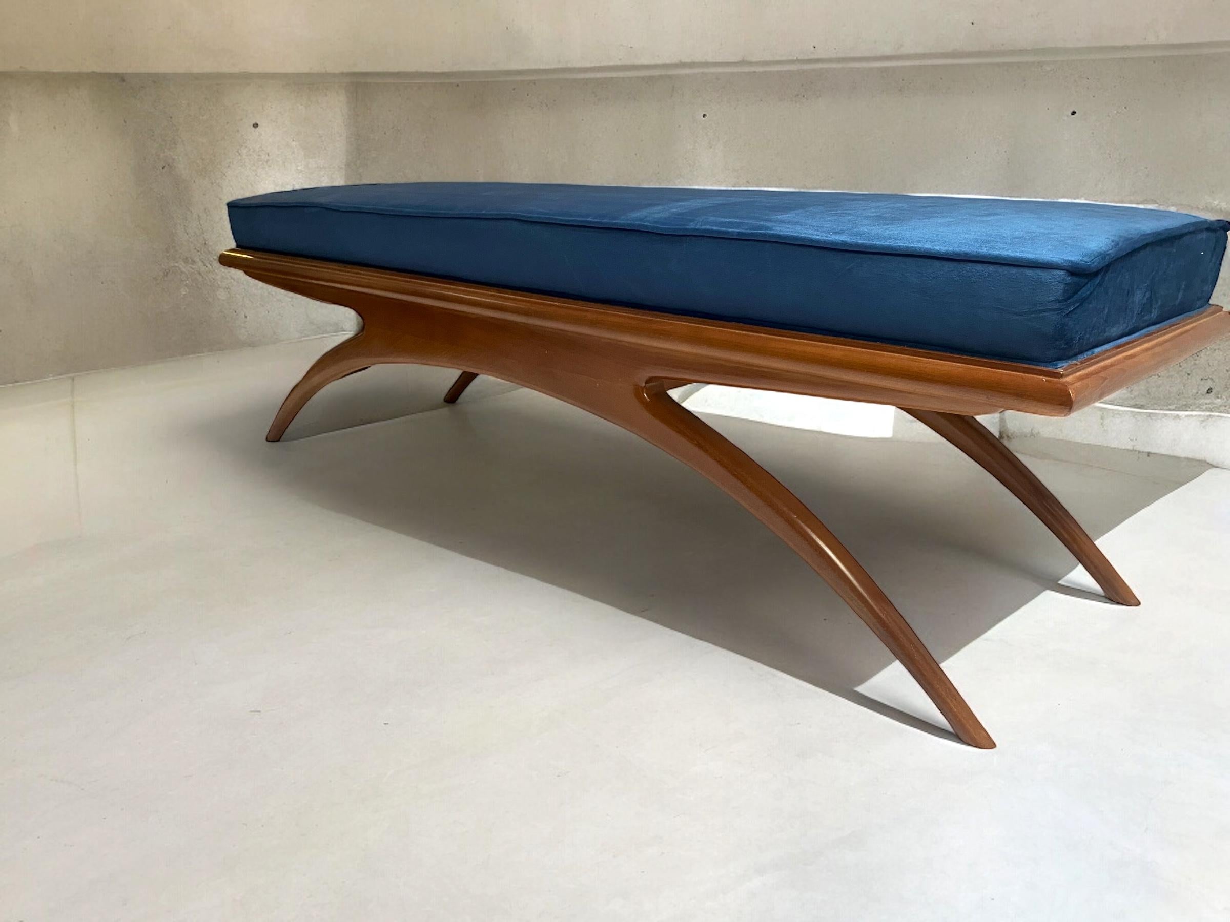 Modern walnut sculpted  bench or settee inspired by Gio Ponti the famous Italian Mid - Century designer .
Blue velvet cushion newly upholstered .
Available also a pair .
 