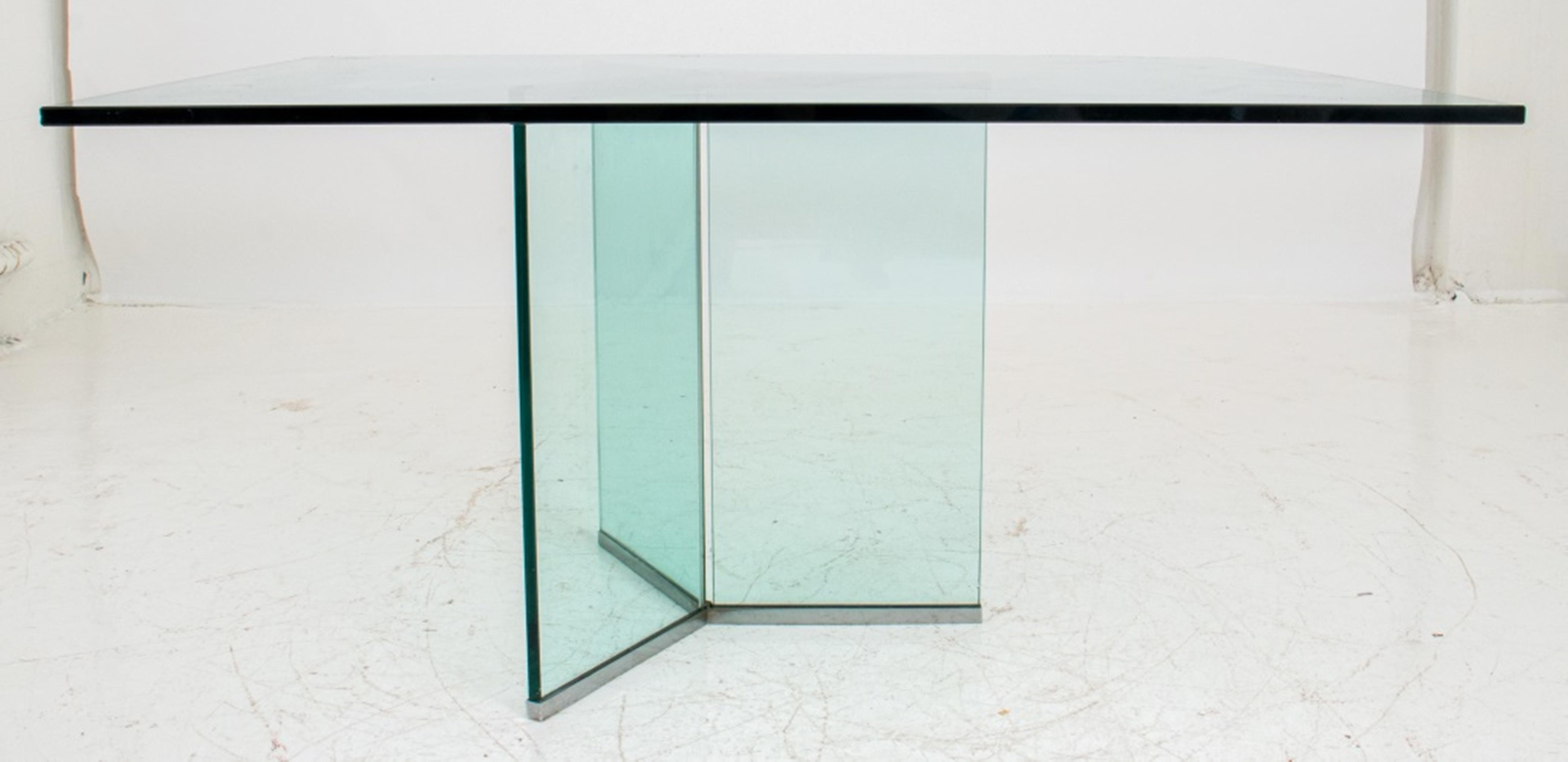 Modern glass rectangular table with a tripartite base and chrome accents, unmarked. Measures: 27.75