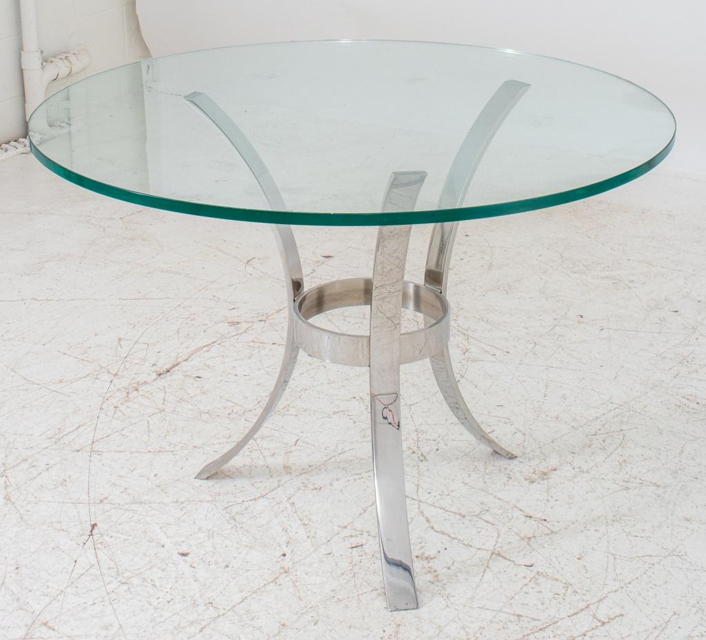 Modern design round dining table with three legs shinny metal base and glass top. 29