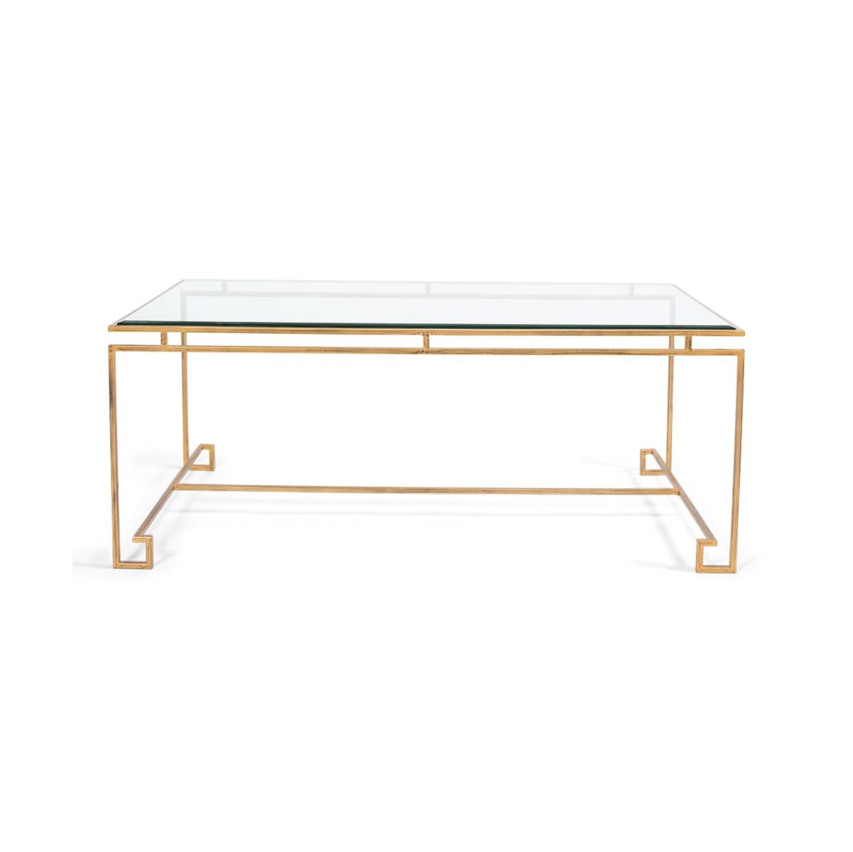 A rectangular tempered glass top cocktail table with an antique gold finish iron base with Greek key form feet.

Dimensions: 48