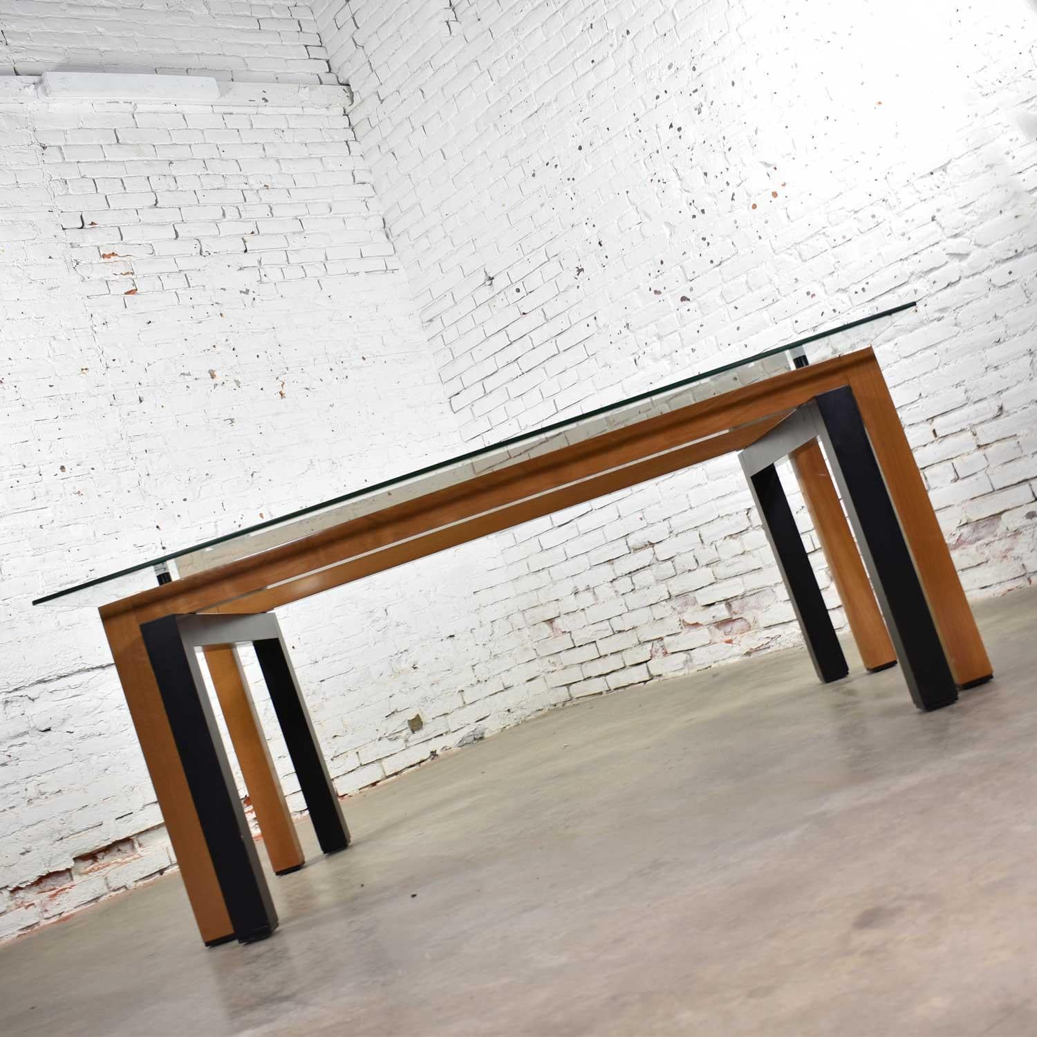 Amazing modern glass top dining table with cherry and black lacquer base made in Italy by Pietro Costantini. Most likely imported and offered by Ello Furniture although it is not tagged it is well documented. It is in wonderful vintage condition
