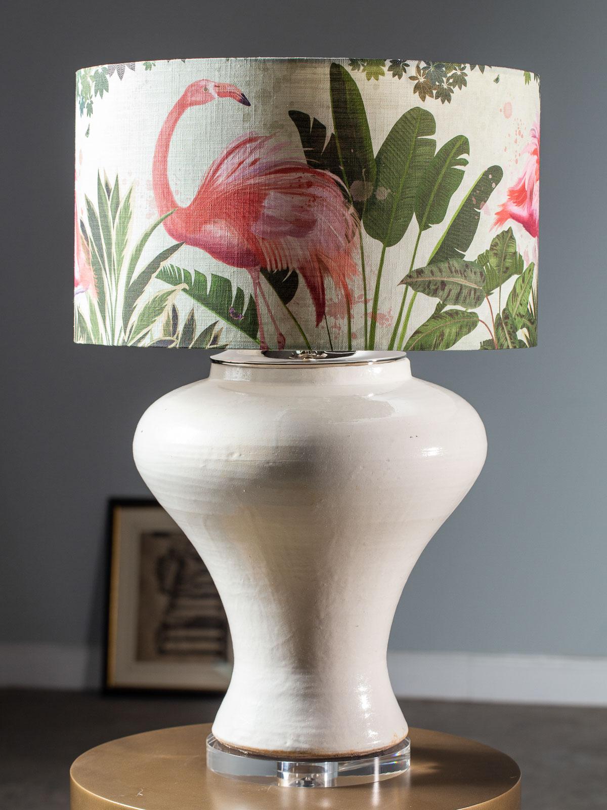 A hand made modern glazed ceramic vase vessel with a wide neck now transformed into a custom lamp. Fitted with nickel silver hardware and mounted on a circular Lucite base this custom lamp takes a standard base bulb. Now topped with a linen shade