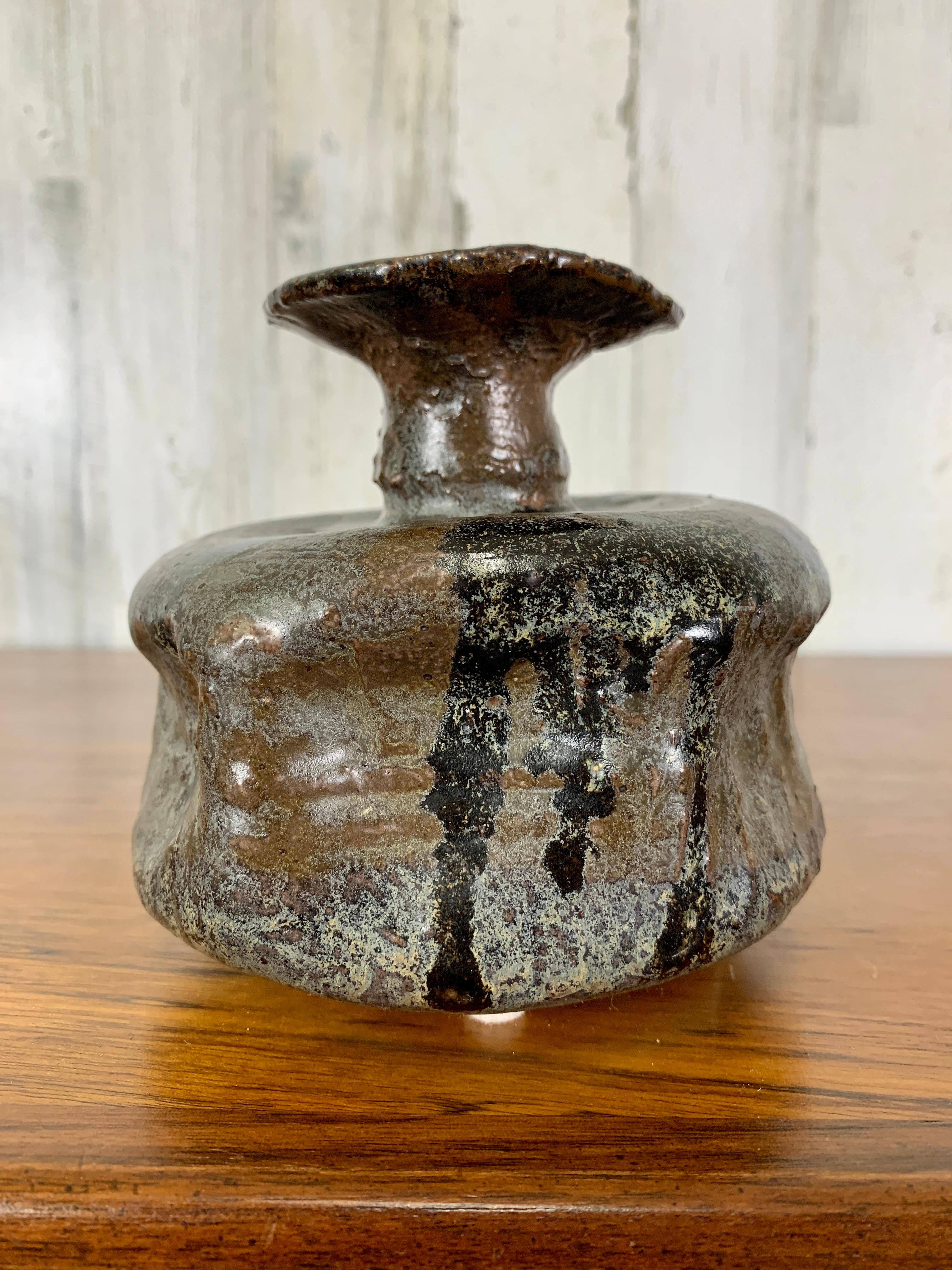 Mid-century squat pottery with abstract glaze.