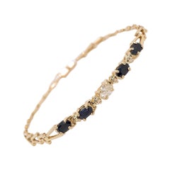 Modern Gold 0.55 Carat Natural Colorless Oval Diamond and Sapphire Gem Bracelet