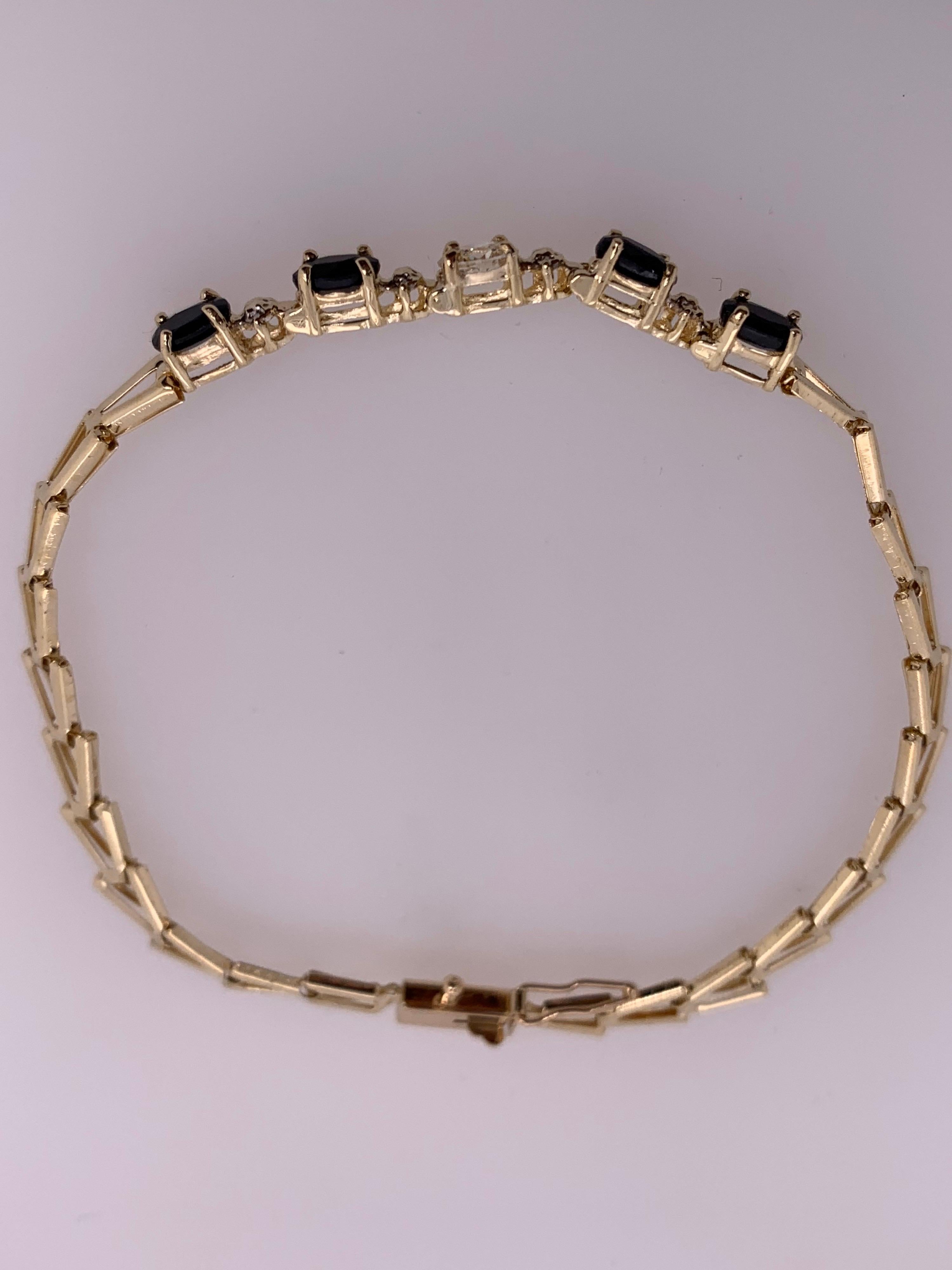 Oval Cut Modern Gold 0.55 Carat Natural Colorless Oval Diamond and Sapphire Gem Bracelet