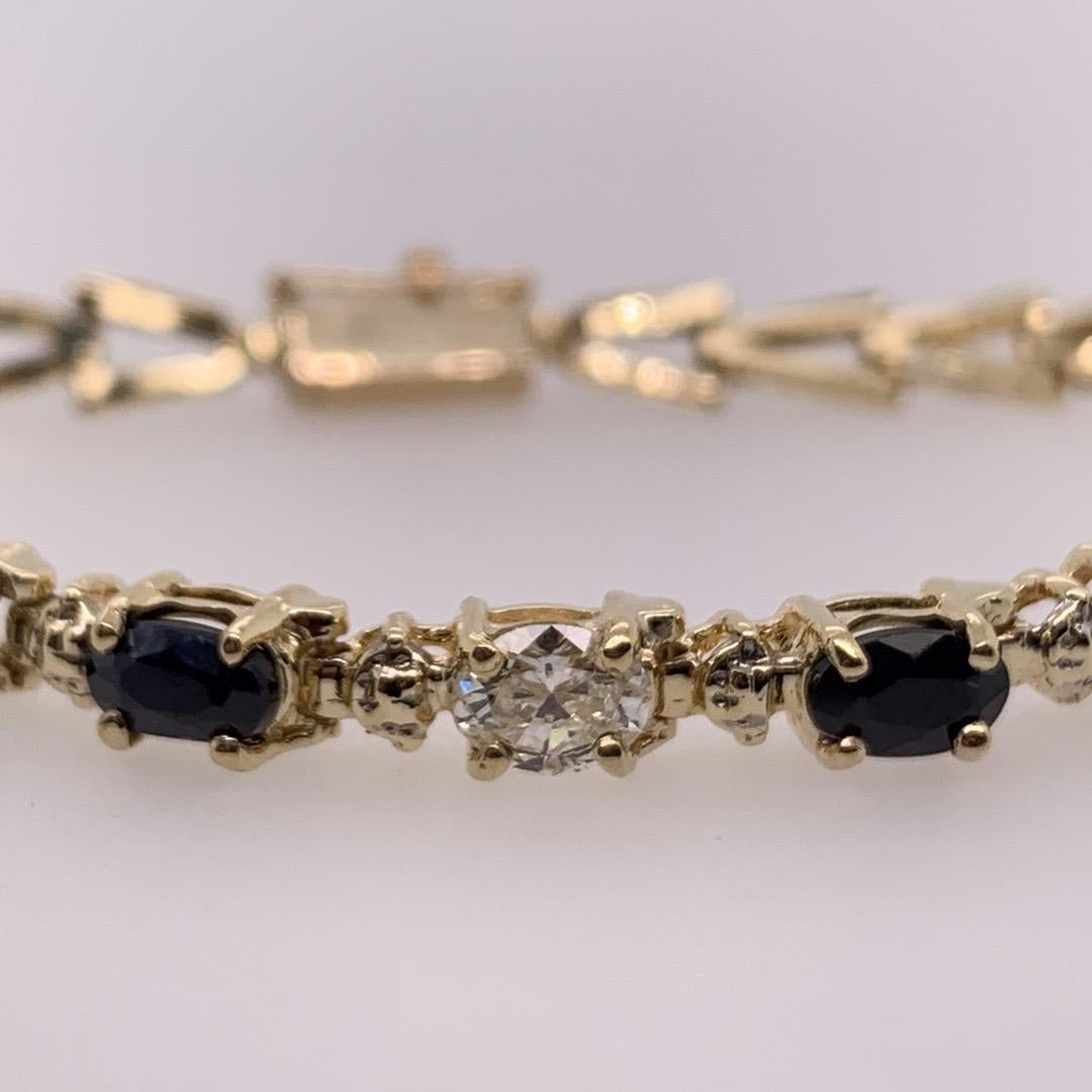 Modern Gold 0.55 Carat Natural Colorless Oval Diamond and Sapphire Gem Bracelet 1