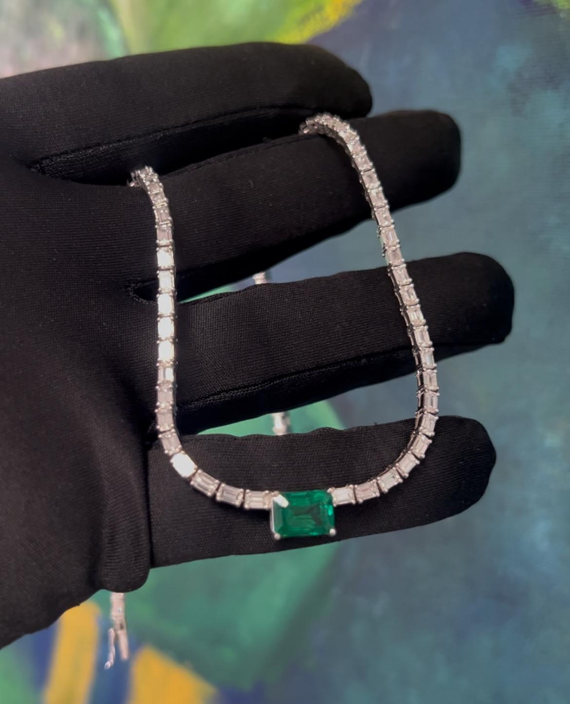 A magnificent 14.77 carat natural emerald and diamond necklace, set in 18k white gold. 
The 2.52 carat center stone is a natural green emerald originating from Zambia. The GIA certificate number is 2235100191 and measures 9.38x6.68x5.50mm.
The