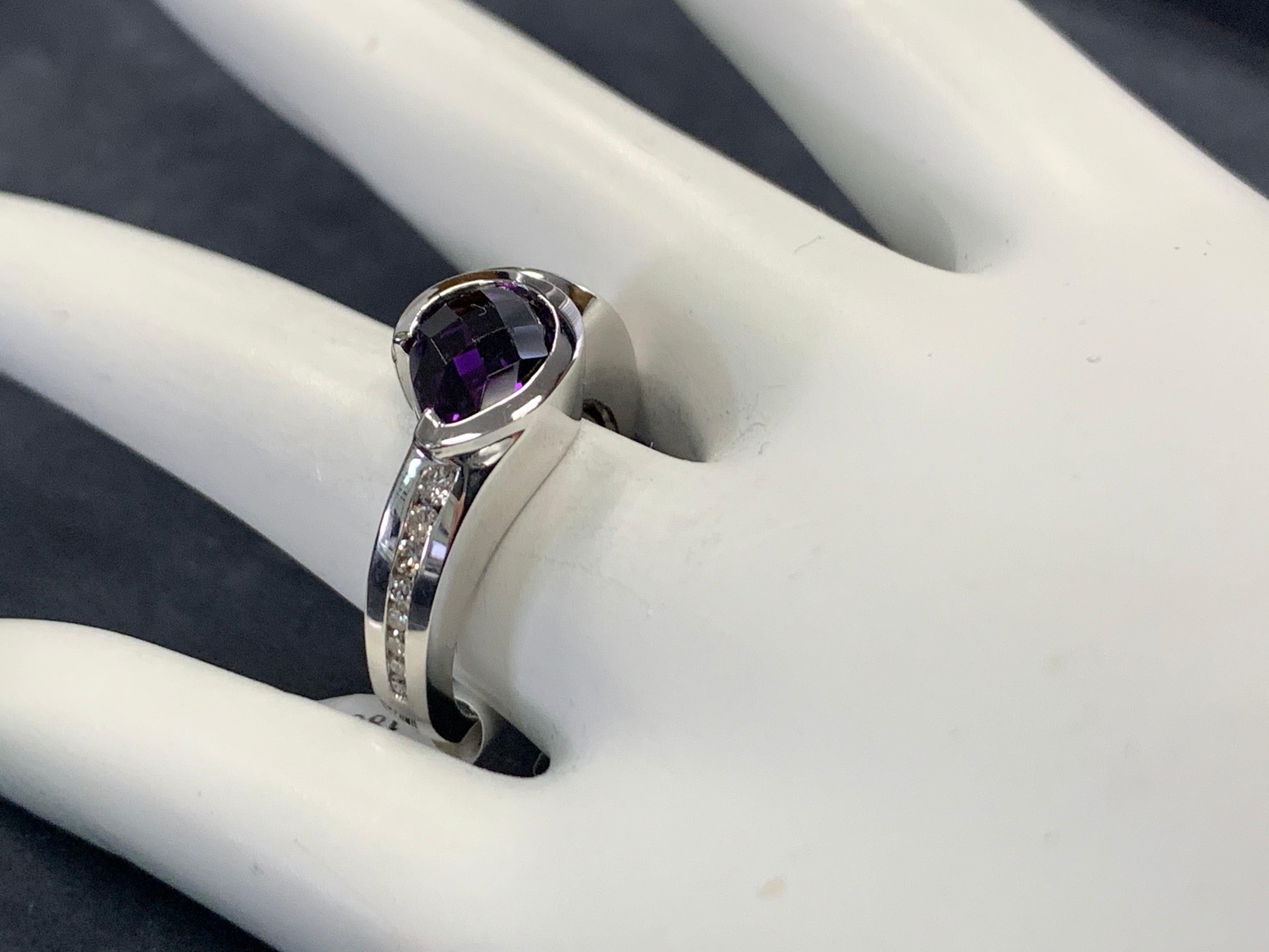 Modern 14k White Gold 1.55 Carat Natural Purple Amethyst (1.40 ct) & Diamond (.15ct)  Cocktail Ring. 

The ring weighs 7.6 grams and is a size 6.25.