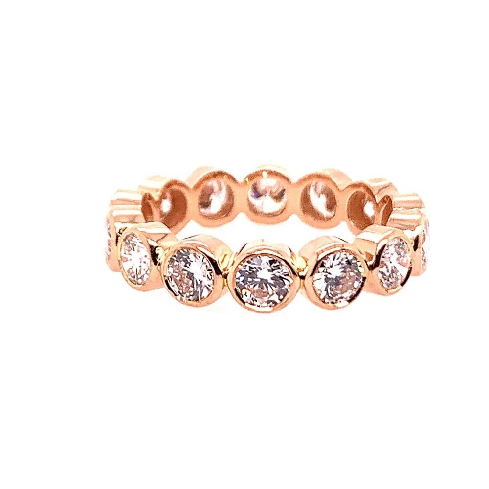 Gorgeous hand made round brilliant diamond band (size 5.75) set in 18k rose gold.

The 14 diamonds are 3.5mm diameter and are collection quality. Most are approximately E-F in color and VS in clarity.