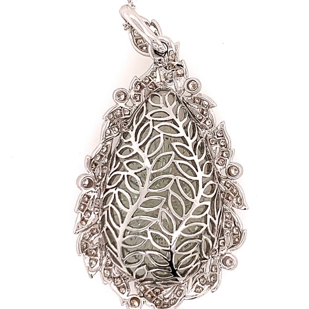 Modern 18k Gold 40.34 Carat Natural Hand Carved Green Amethyst Gem & Diamond Pendant.

The piece weighs 19.54 grams without the chain, the chain is not included.