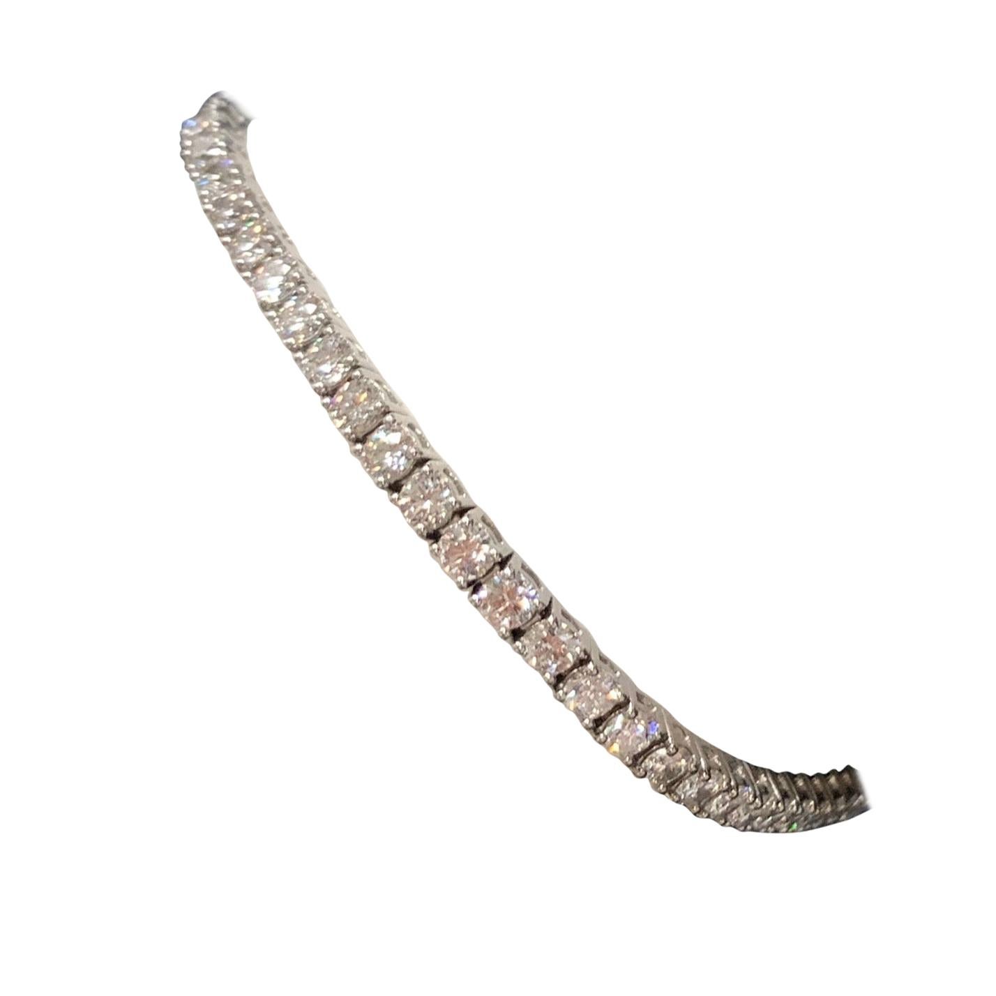 Stunning 14K White Gold Classic Tennis Bracelet weighing 5.68 carats. 

It is set with 57 ideal cut natural round brilliant diamonds measuring 2.95mm, approximately F-G in color and VS2-SI1 in clarity. 

The bracelet itself weighs 12.33 grams and is