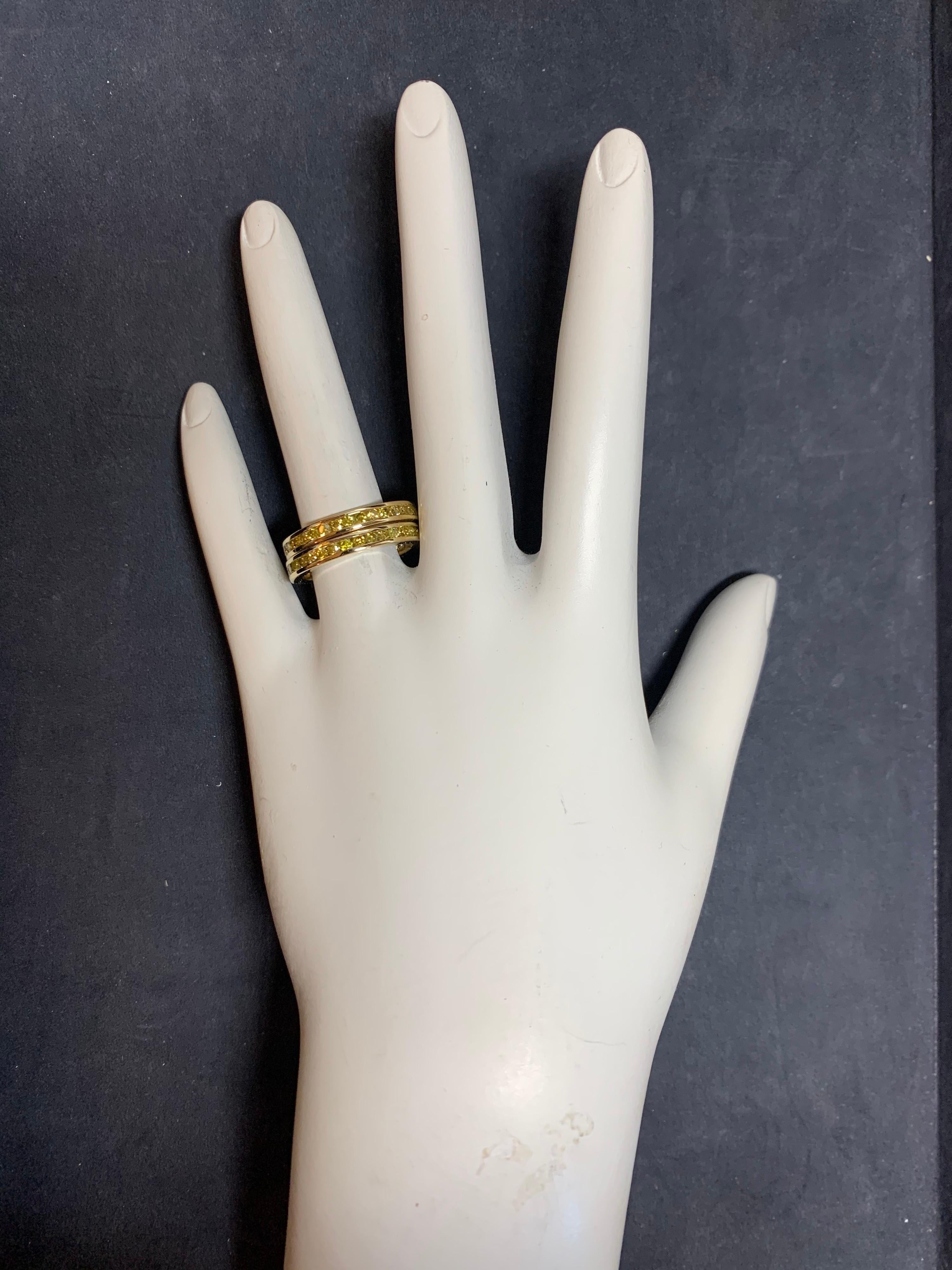 Modern Yellow Gold Matching Band Set.

Each band is set with 34 Natural Fancy Intense Yellow Canary Diamonds weighing 1.70 carats each, 3.40 Carats Total. Weights are approximate.

Ring size is 6.75, weight is 2.6 grams each (5.2 grams total). Width