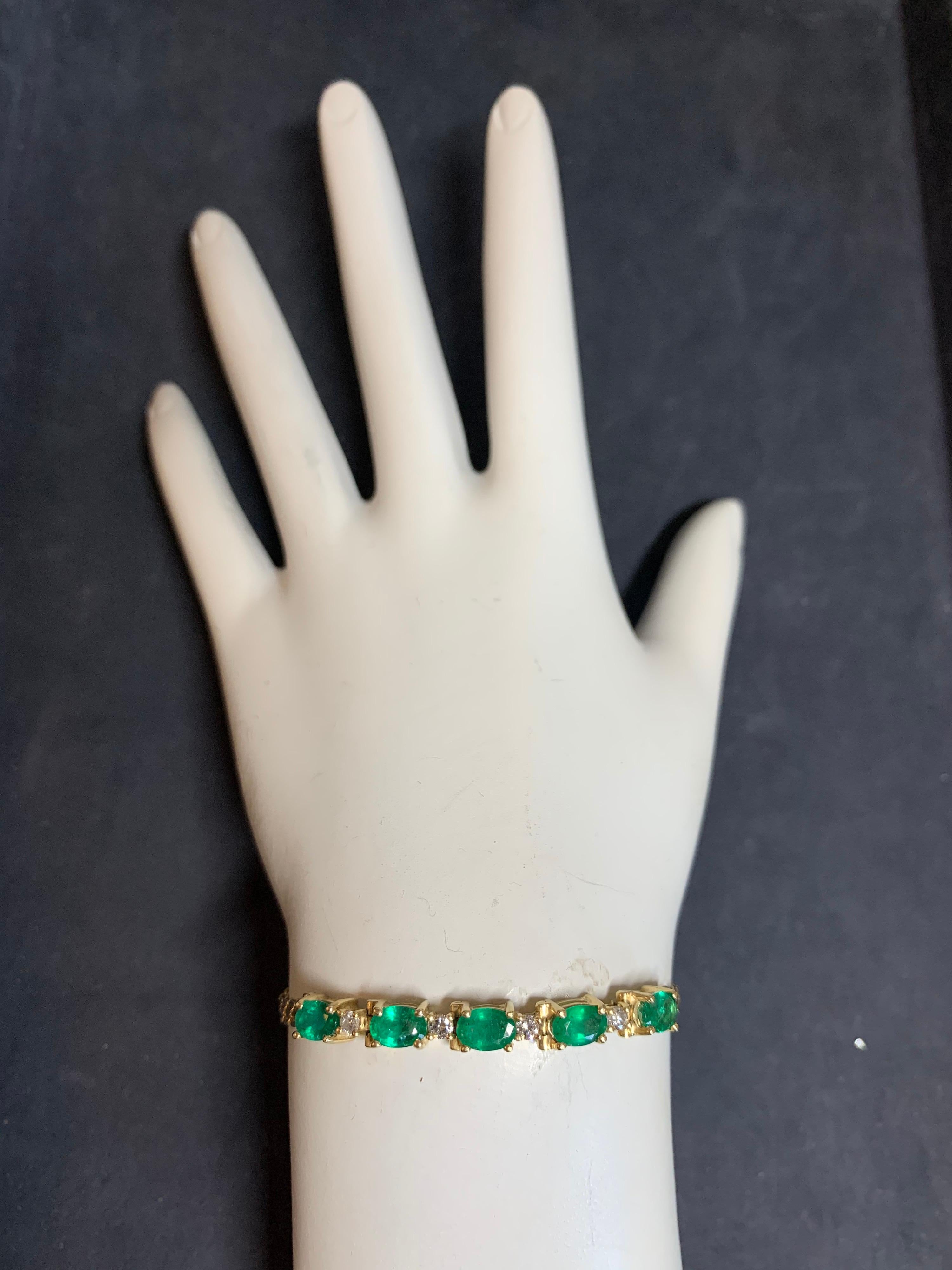 Modern 14k Yellow Gold Bracelet approximately 2.50 Carat Natural Oval Emerald & Diamond. 

The piece was set with 5 oval emeralds (6x4.1x2.8mm) and 4 natural round brilliant diamonds (G-H color, VS clarity). 

Bracelet weighs 6.6 grams and is 7