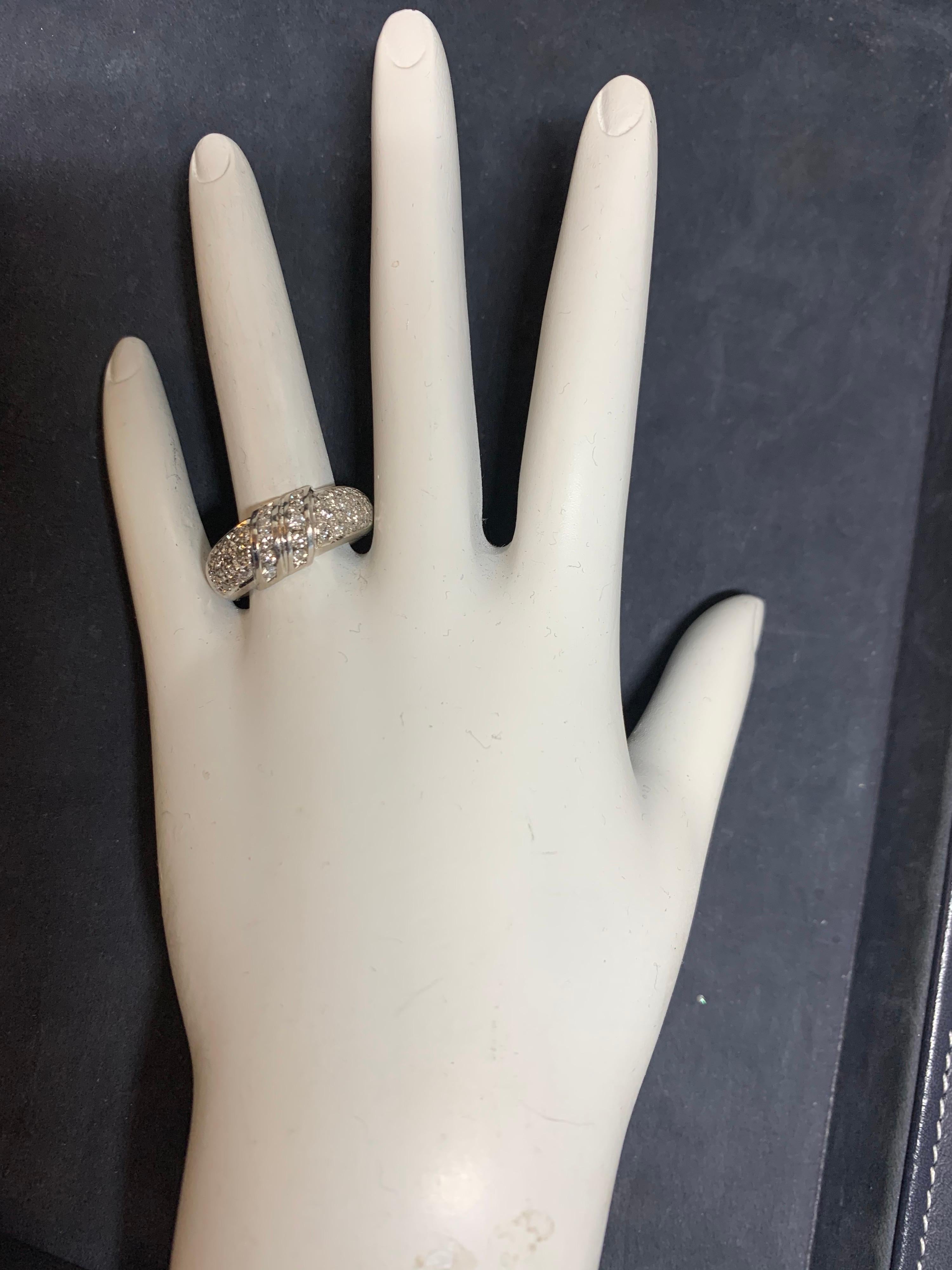 Stunning Modern White Gold Cocktail Band set with Natural Colorless Diamonds, approximately 1 carat of 34 natural round brilliant diamonds (approximately G-H in color and VS-SI in clarity). 

Ring size is 7.75 and weighs 6.9 grams.

Circa 1980.