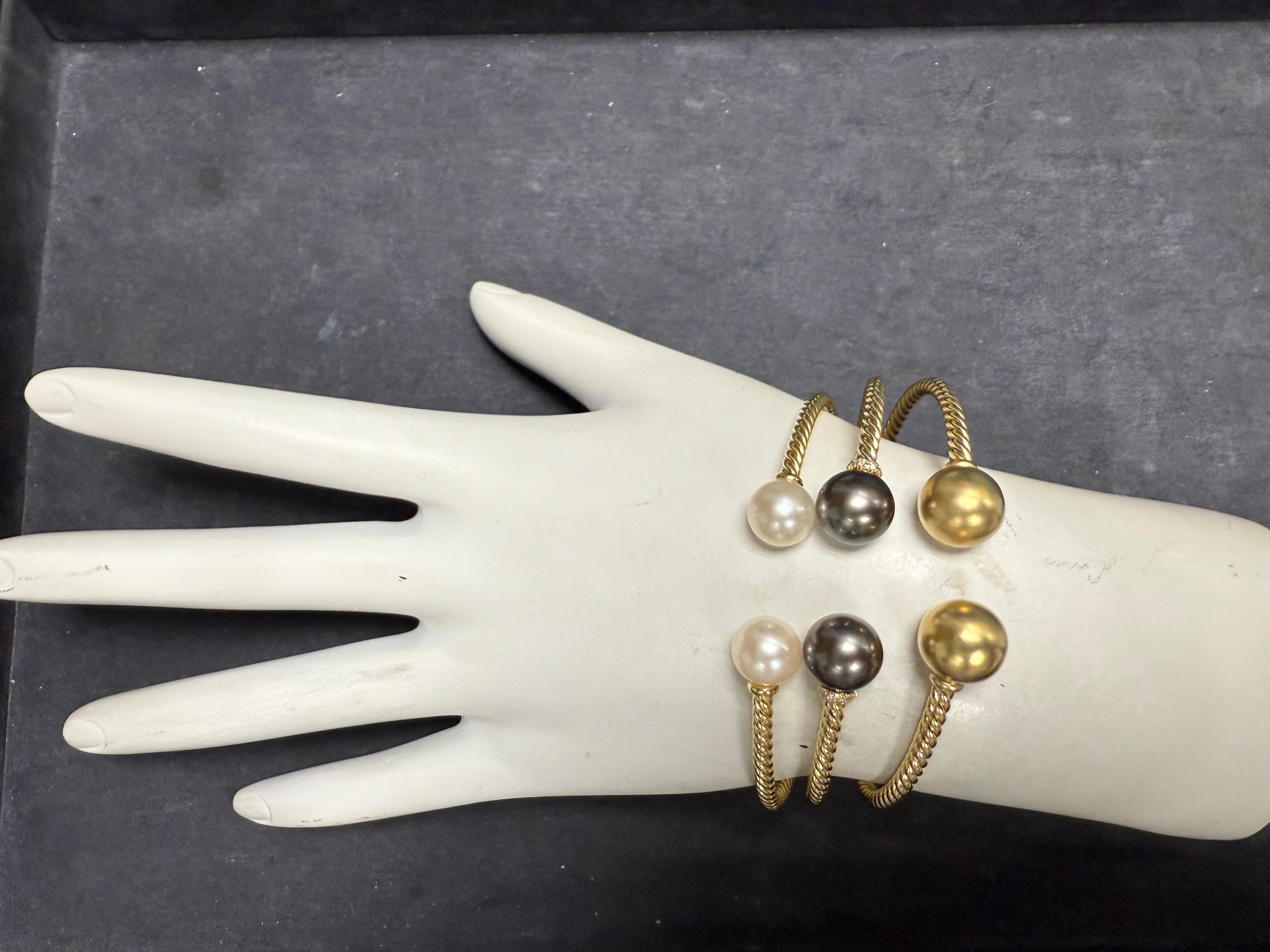 Modern 18 karat yellow gold flexible bangle bracelet set by David Yurman from the Solari Collection. Each piece is hallmarked “DY 750” and marked “M”, indicating medium size—designed for wrists approximately 6 to 6.5 inches. The bracelet measures