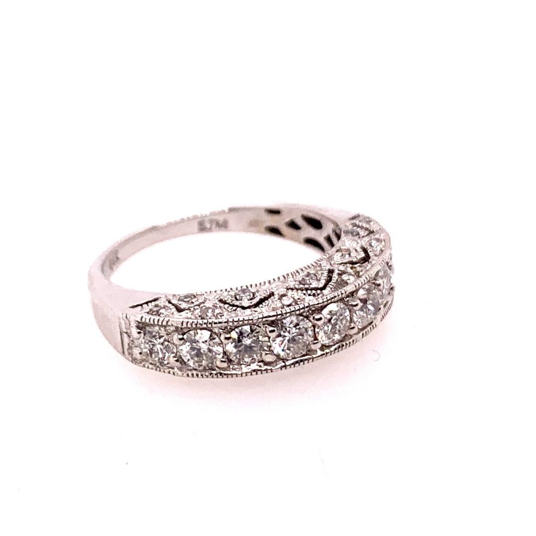 Modern 14k White Gold Engagement Band.

Set with an approximate total weight of 1.25 carats are 31 Natural Colorless Diamonds, F-G in color and SI-I in clarity.

The ring size is 6.25 and weight is 3.1 grams.

Condition is Pre-owned.