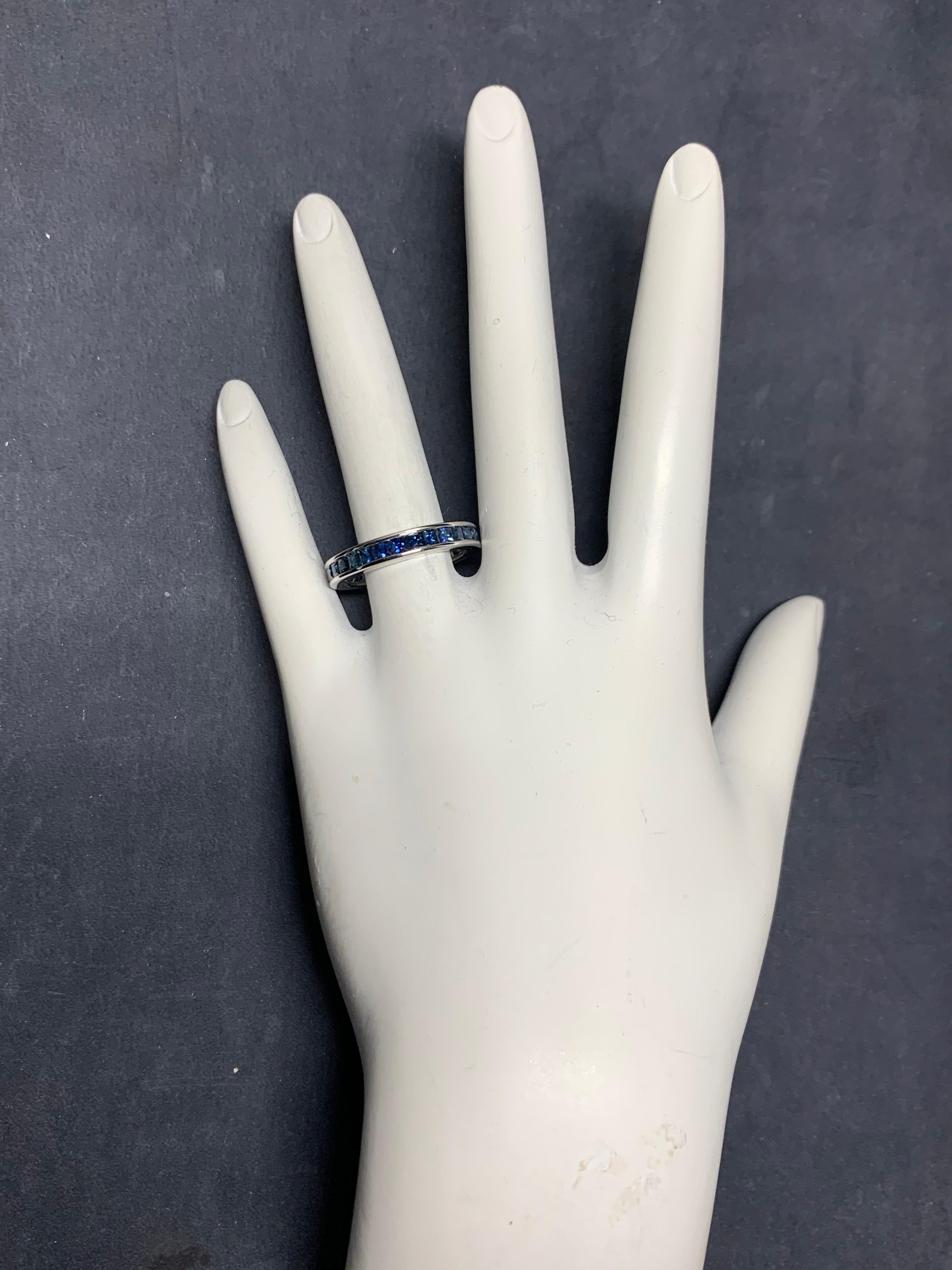 Modern 14k White Gold Eternity Band set with 2.25 Carats Natural Blue Sapphires. 

The ring is a size 7.25, width 3.7mm, weighs 3.59 grams.
