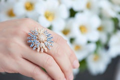 Modern Gold Kinetic Flower Petal White Diamond and Blue Sapphire Cocktail Ring