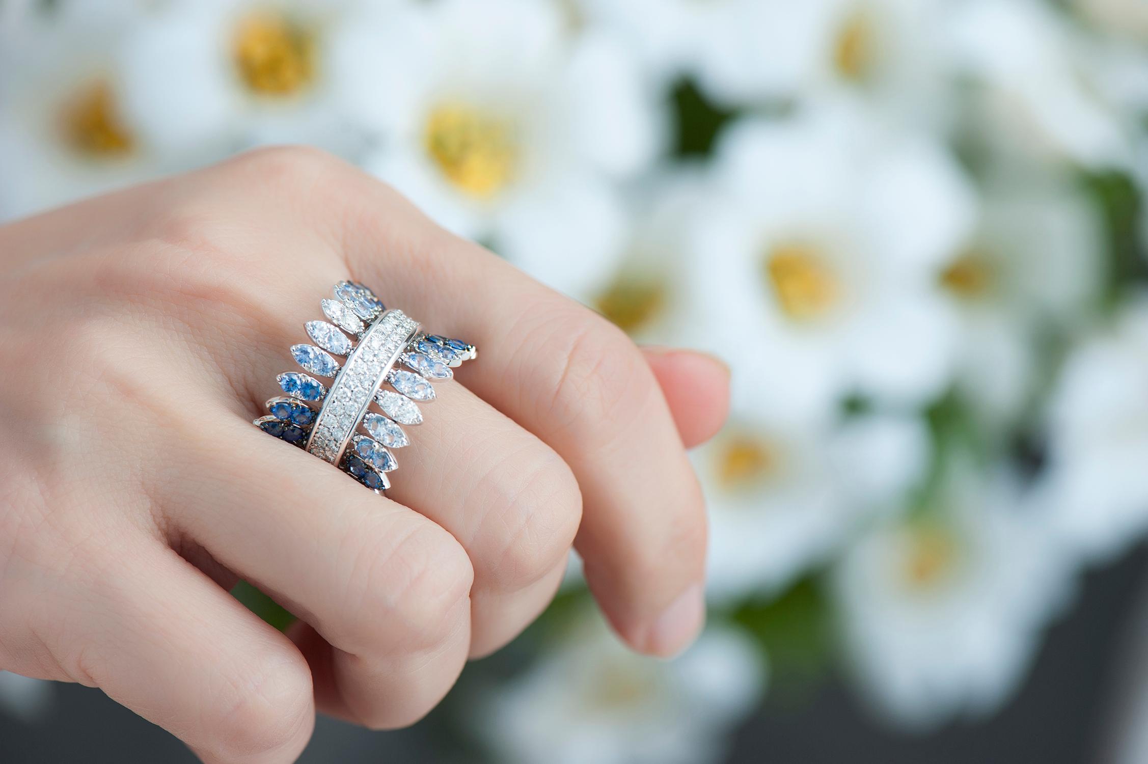 18K White Gold Spettinato Ring with White Diamonds and Blue Sapphires.
Petals are kinetic with movement.
Gold Weight: 10.30 grams
Carats: Diamond Carats: 0.80, Sapphire Carats: 2.21
FerrariFirenze, Handmade in Italy.
US Ring Size: 5
Style:
