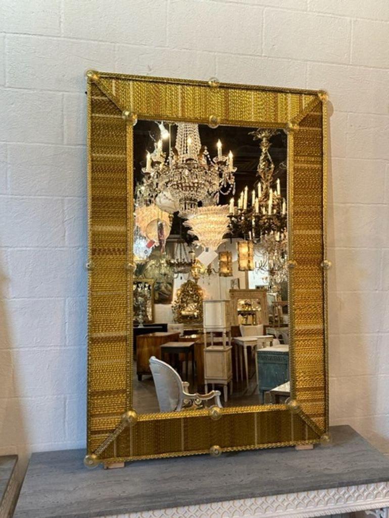 Gorgeous modern gold textured Murano glass large scale mirrors. A favorite of top designers that creates a very upscale look.  Stunning!  Note: Price listed is for one.