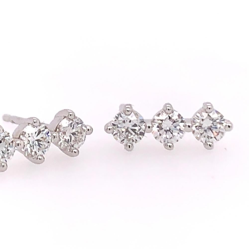 Modern 18k White Gold Natural Round Brilliant Diamond Earrings weighing 0.72 Carats. 

Each of the six round brilliants are approximately 3.1mm diameter, F in color and VS in clarity.

Total weight is 1.32 grams, push back posts.
