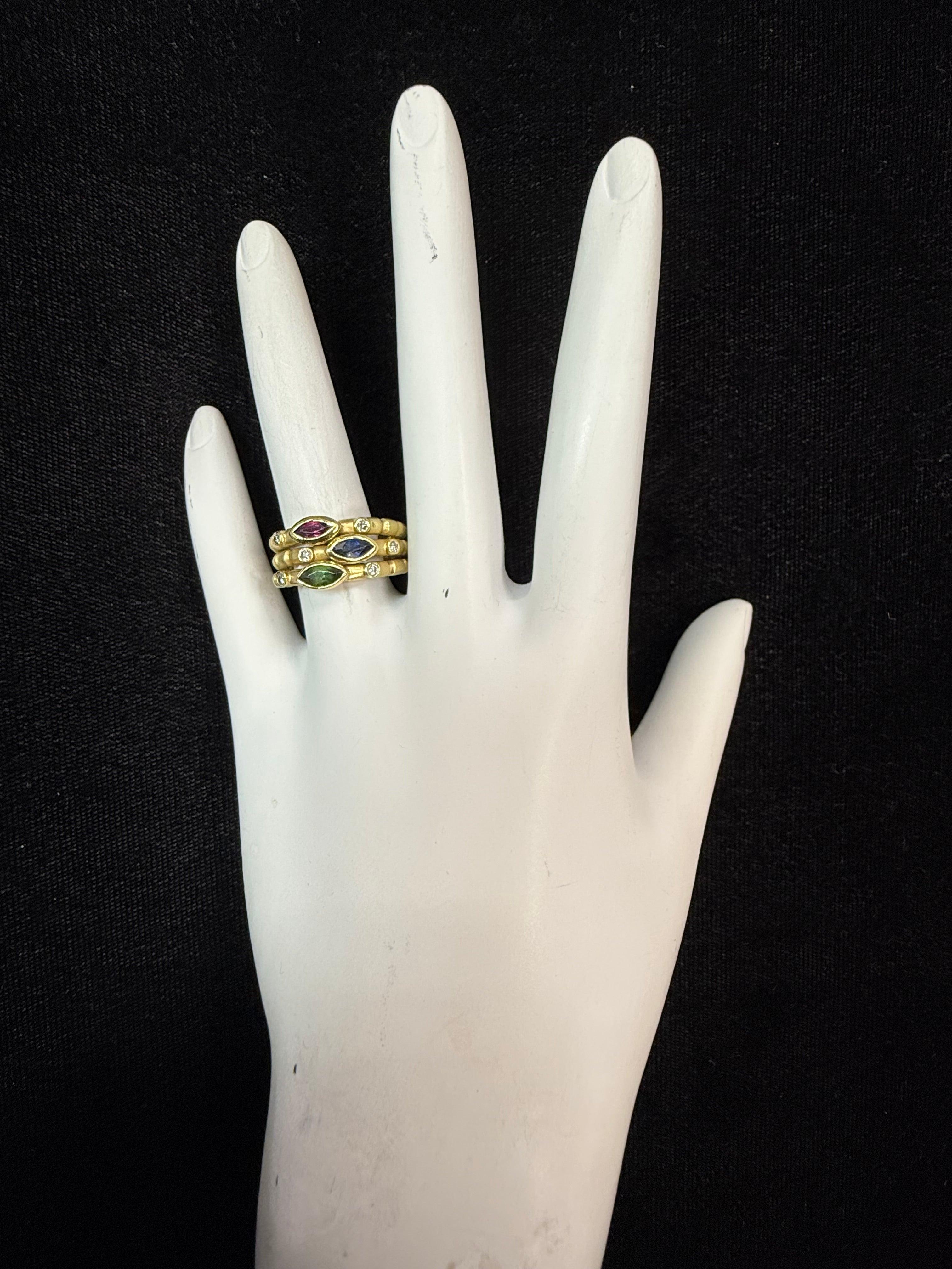 Retro 18K yellow gold statement ring featuring a bold three-layer stacked design set with multicolor gemstones, including marquise-cut ruby, sapphire, and emerald, each measuring approximately 6 x 3 mm. Accented with six natural colorless diamonds,