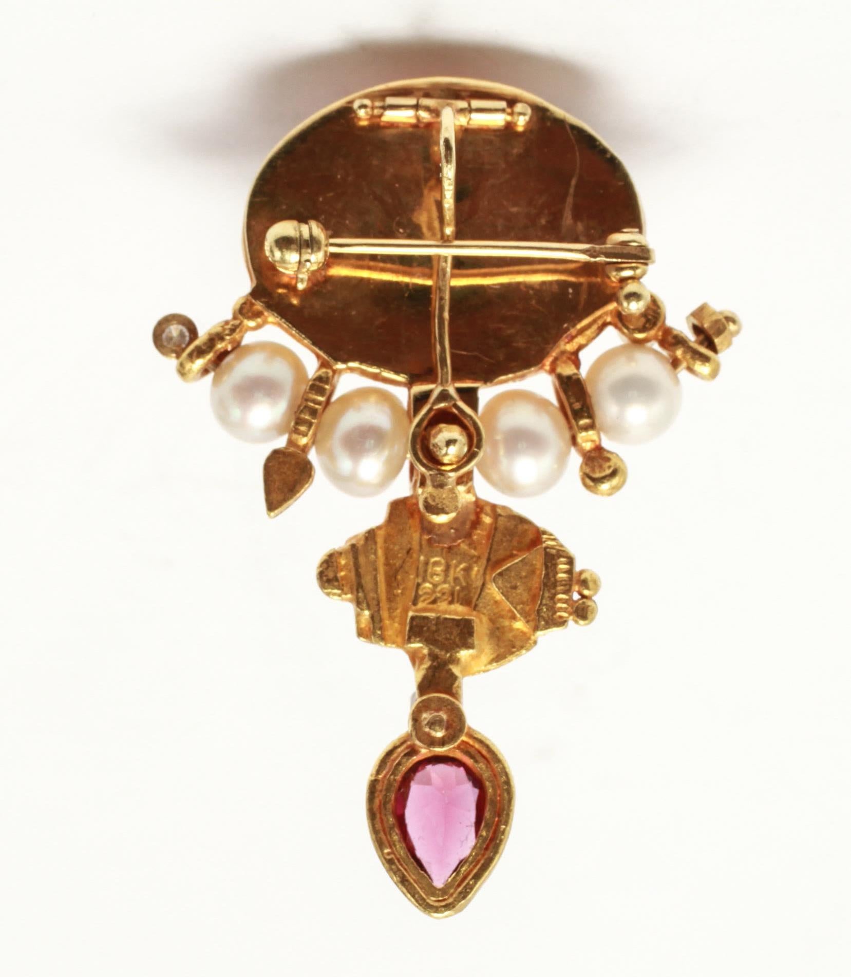 Modern pendant brooch in high karat (22K and 18K) yellow gold with a large cabochon oval rose quartz, pearls, diamonds and a pear-shaped faceted amethyst. The piece is marked on the back: 