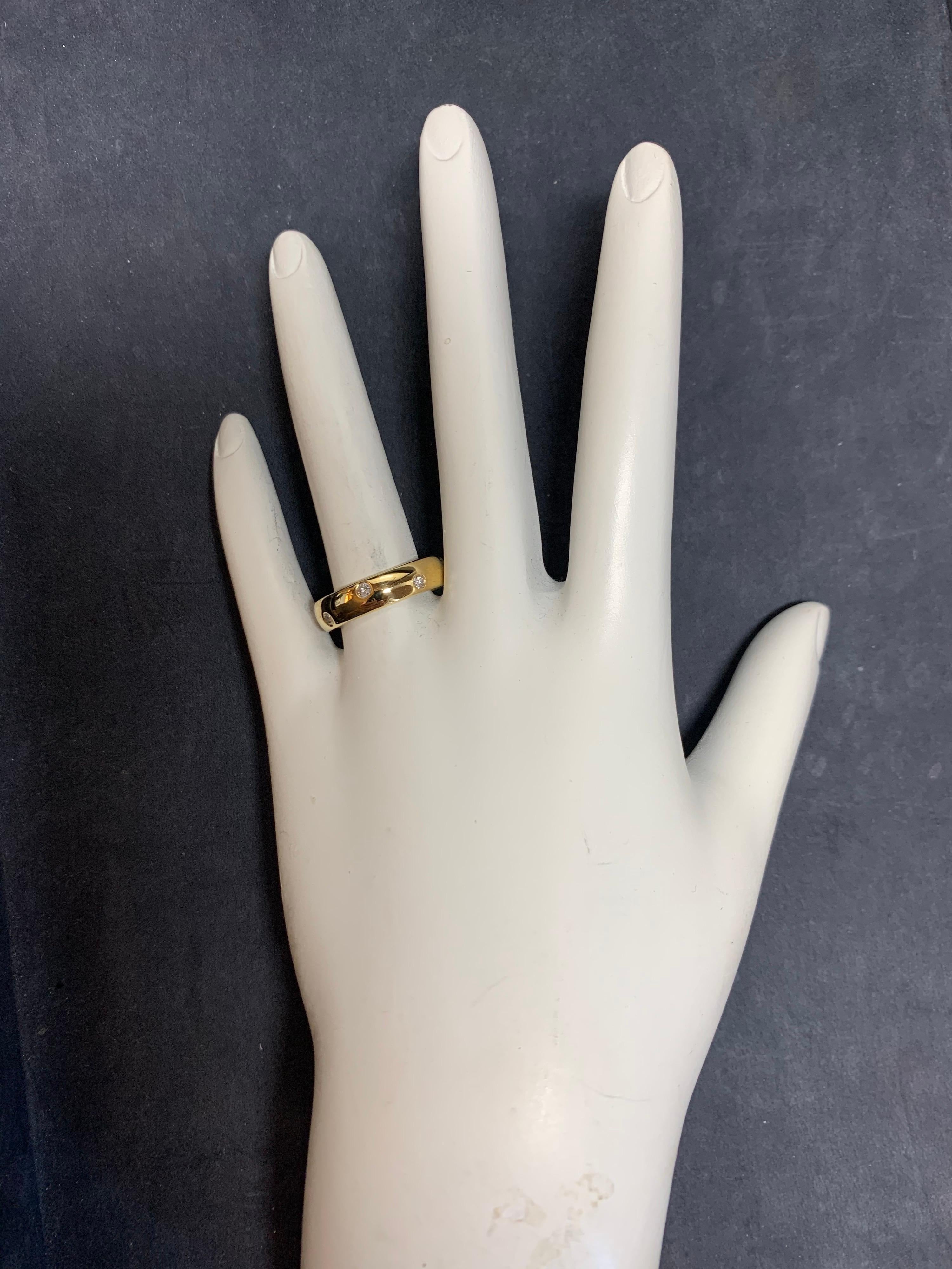 Modern 18k Yellow Gold Ring set with 8 Rounds,  0.45 Carat Natural Colorless Diamonds.

The ring size is 6.75, weight is 5.7 grams, and width is 4.7mm. 

Condition is Pre-owned. 