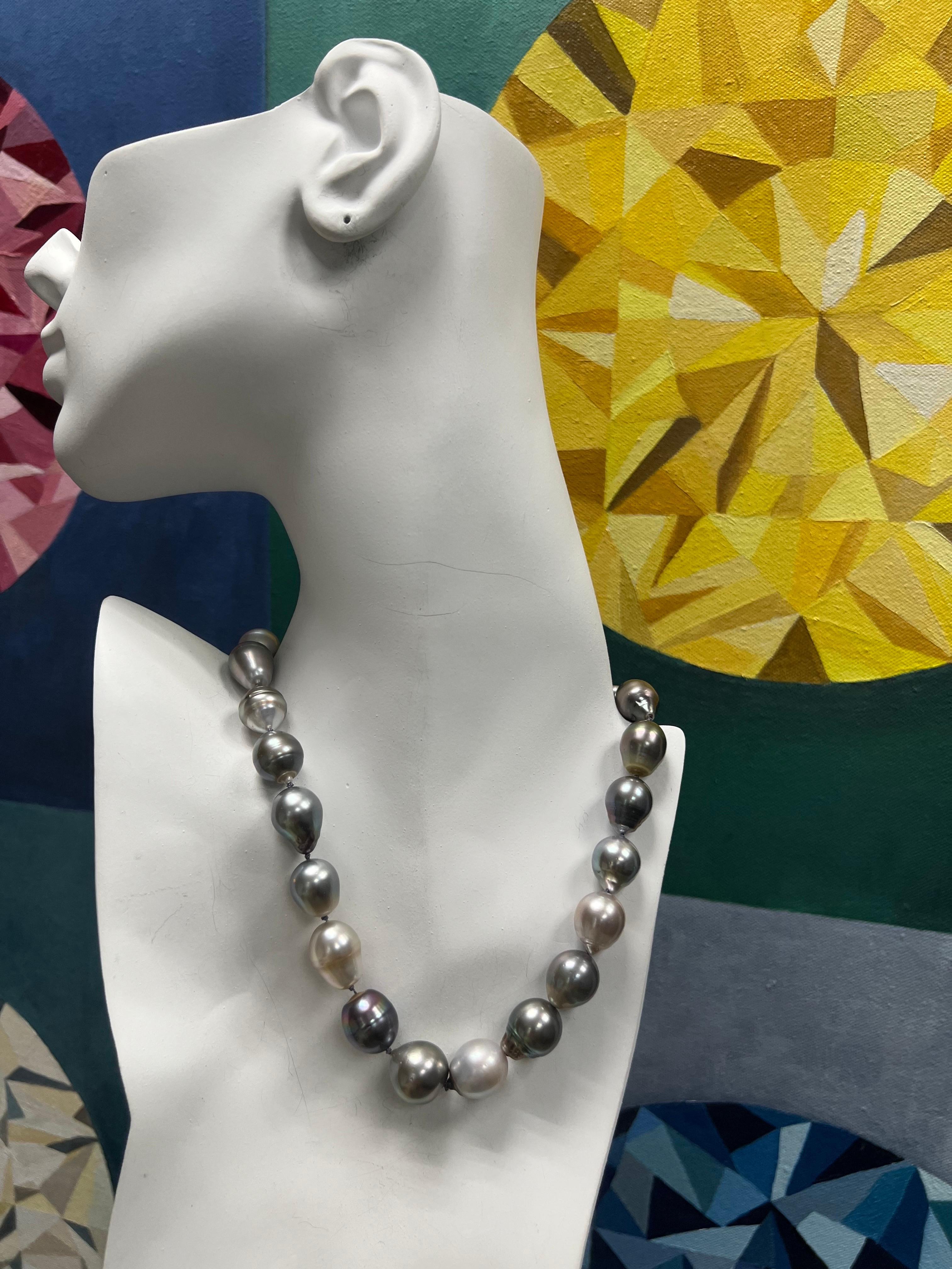 Modern Gold Tahitian Baroque 11-14.5mm Pearl 15.75 Inch Toggle Clasp Necklace

It is set with 23 magnificent larger 11-14.5mm pearls with bold multi colors. Very Good Surface, Radiant High Luster, and Very Thick Nacre. The toggle clasp is 18k Yellow