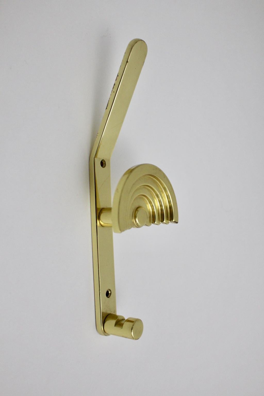 This coat hook shaped like an umbrella was designed by Ettore Sottsass Associati Italy 1985 and manufactured by Valli & Valli.
Also the wall hook was made of polished brass. Easy to fix it on the wall with two screws.
Very good vintage condition
