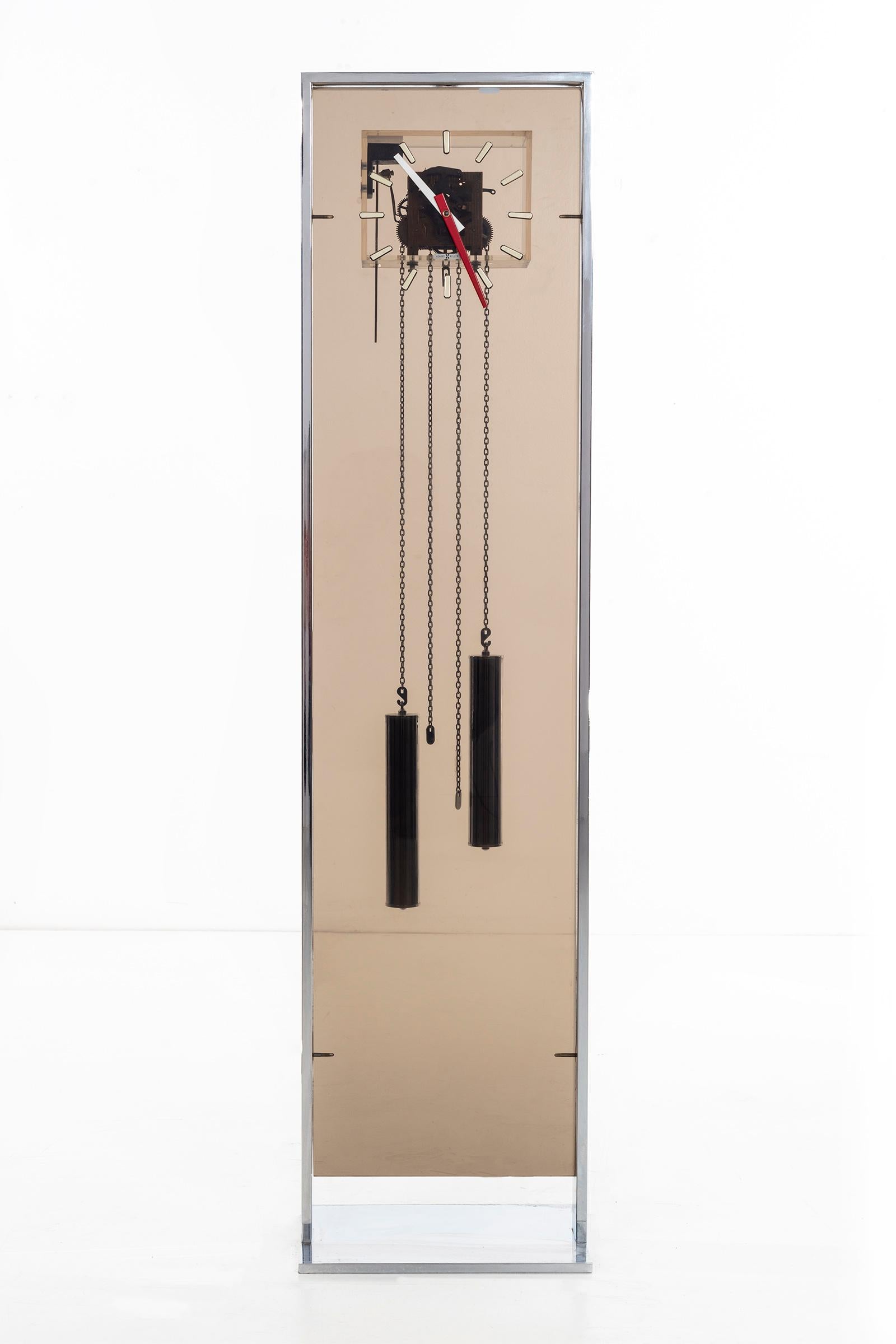 Modern grandfather clock by Howard Miller, chrome and Lucite.
