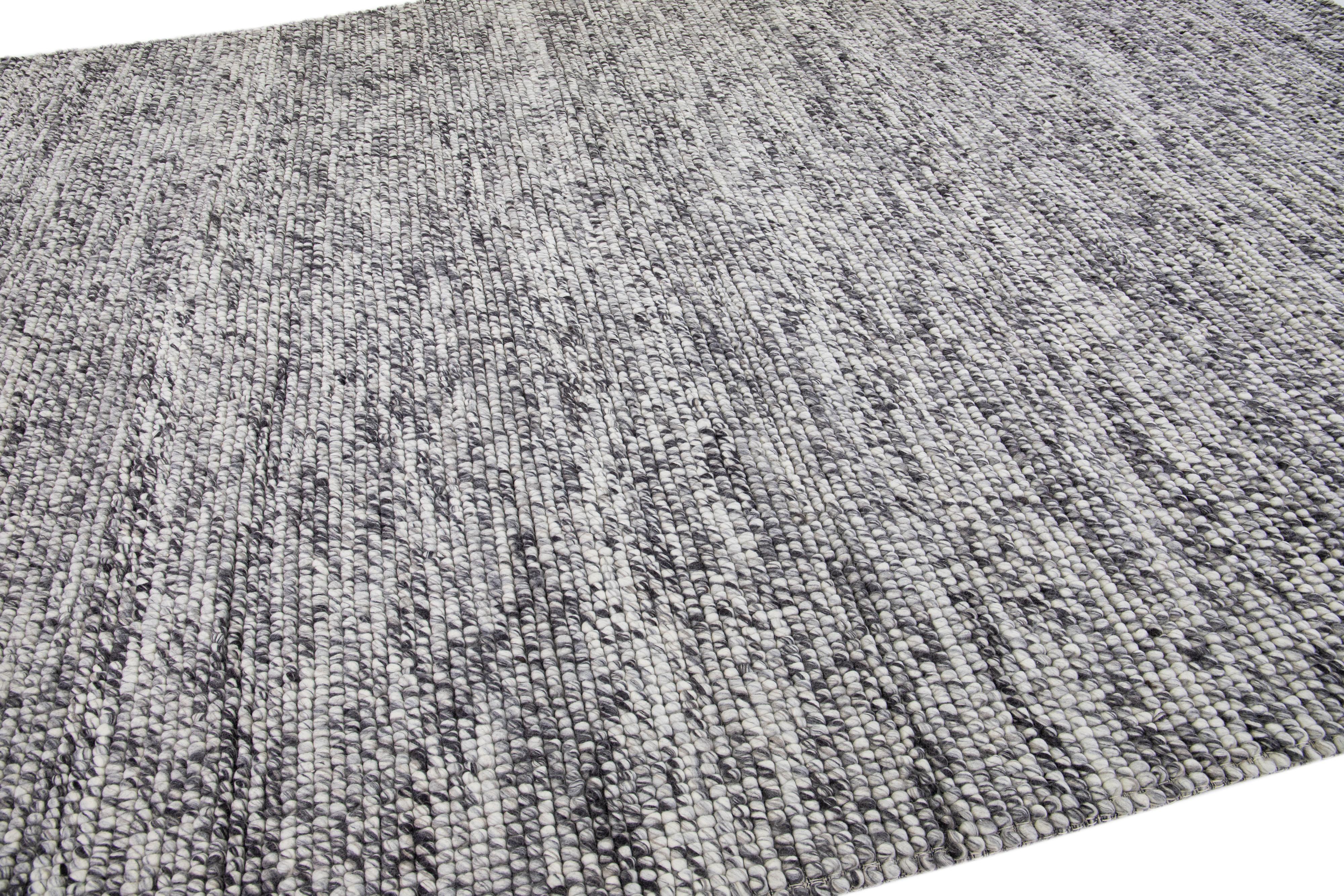 This beautiful Felt hand-woven wool rug is part of our Westport Collection with a gray color field and features an all-over geometric design.

This rug measures: 10' x 14'.

Custom colors and sizes are available upon request.


