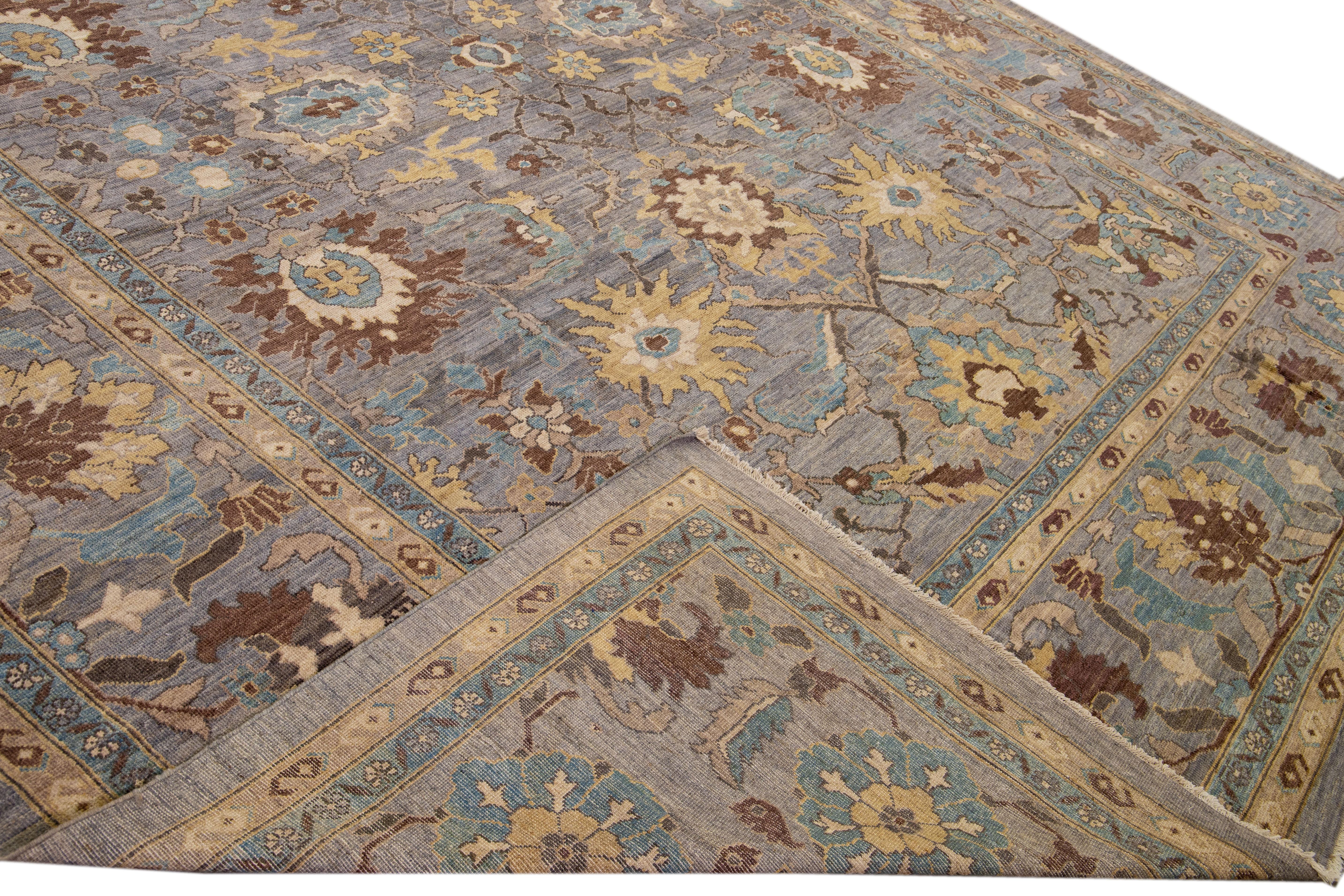 Beautiful modern Sultanabad hand-knotted wool rug with a gray field. This Sultanabad rug has a beige, blue, brown, and goldenrod accent in a gorgeous all-over classic floral pattern design.

This rug measures: 13' x 22'6