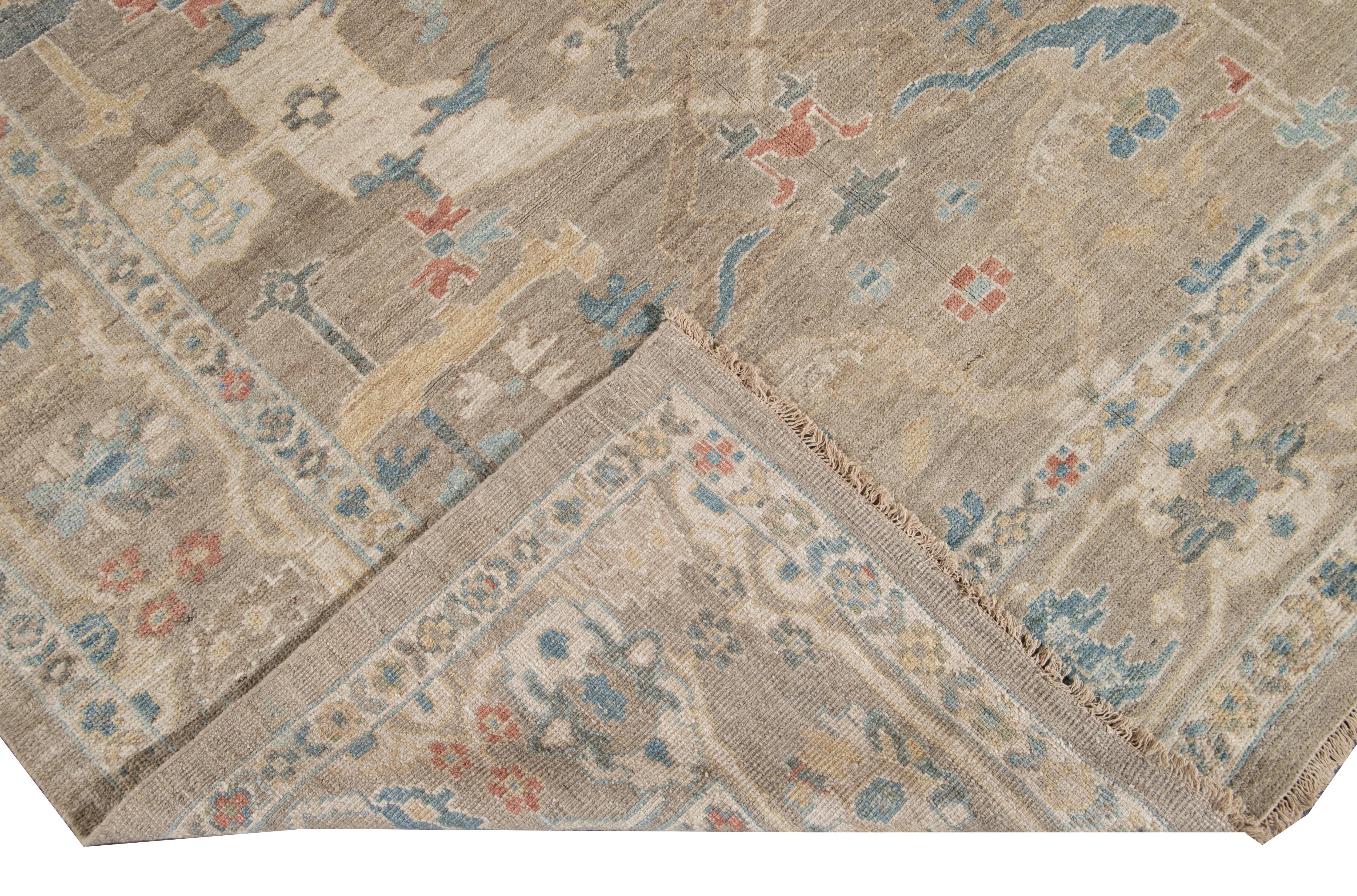 Beautiful modern Sultanabad hand knotted wool rug with a gray field. This Sultanabad rug has a blue, beige, red, and ivory accent in a gorgeous all-over Classic floral medallion design.

This rug measures: 6'11