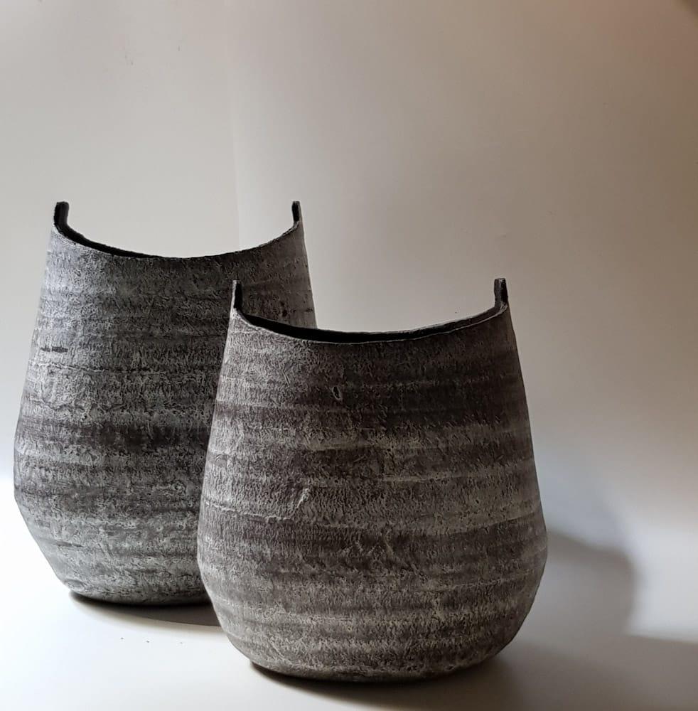 Unique Greek vessels reinvented for a modern appeal by one of Greece favourite artists. Completely hand-made, each vase is one of a kind. The organic look of each piece is reached using age-old techniques honouring Greece's ancient