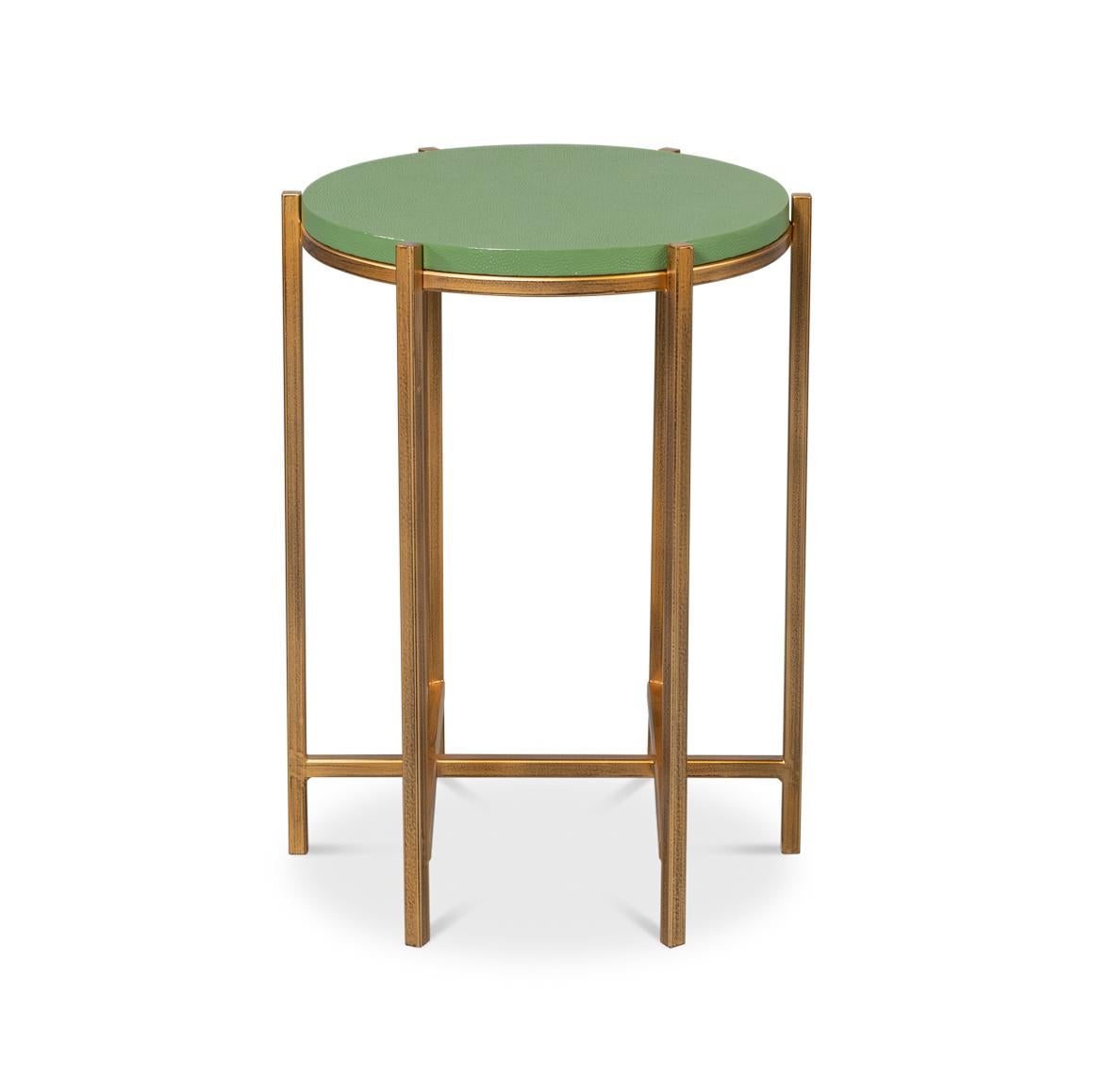 Leather Top Accent Table, where contemporary design meets sophisticated luxury. The table features a stunning watercress green leather-wrapped shagreen embossed round top in a vibrant green hue, creating a sleek and stylish surface.

Supported by a
