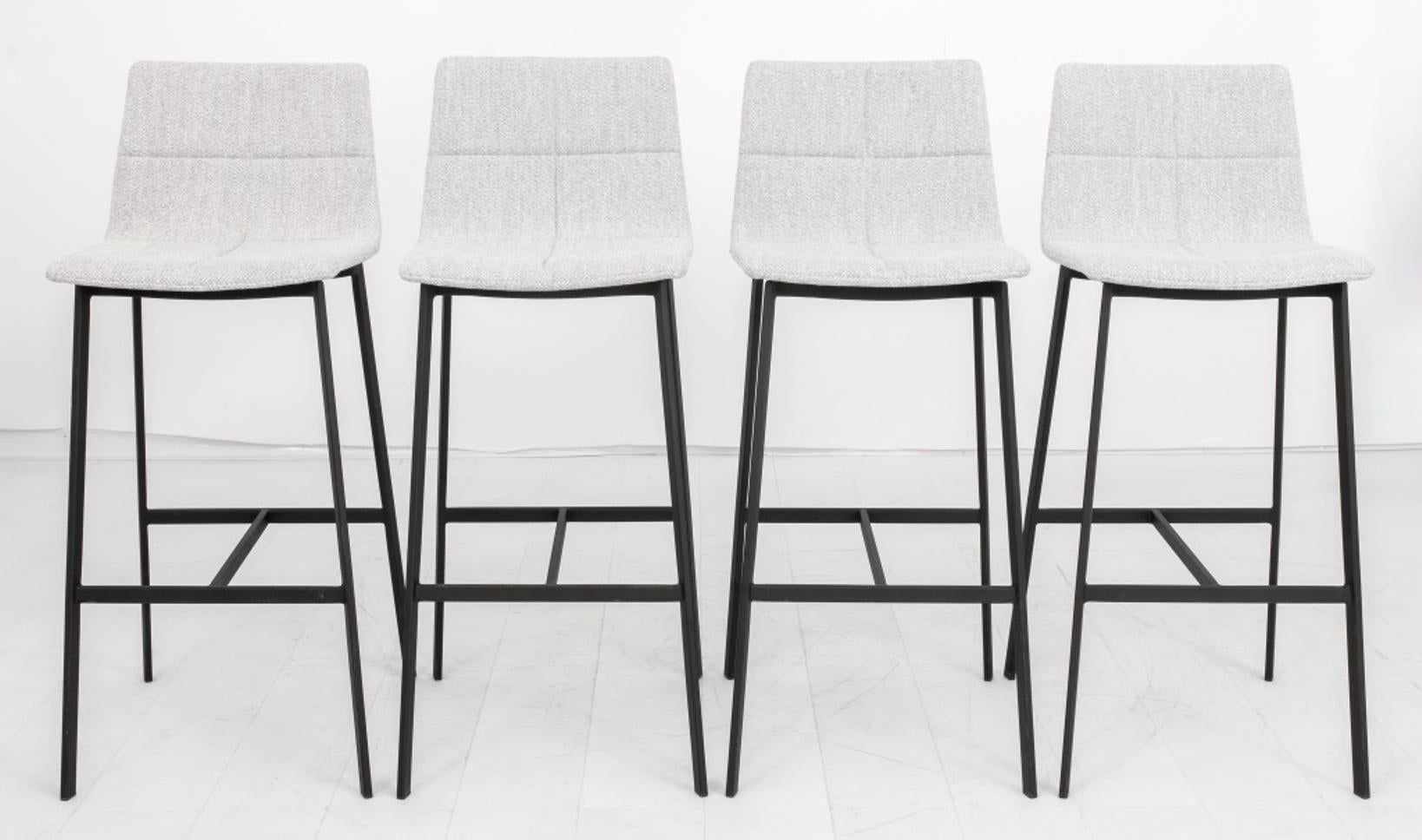 Four Modern grey boucle upholstered bar stools on tall legs conjoined by an H stretcher.

Dimensions: 42