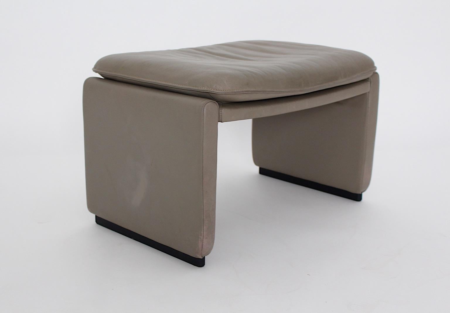 grey leather footstool