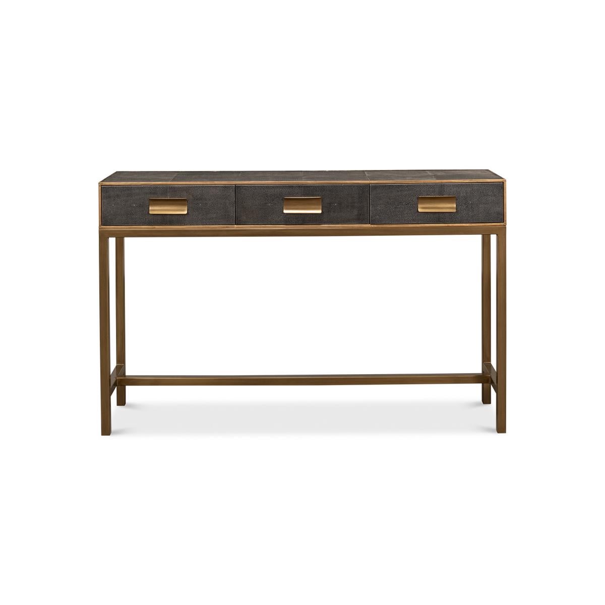Modern grey leather wrapped console with gilt trim, three frieze drawers with marbleized interiors, brass handles and raised on H stretcher base.

Dimensions: 54