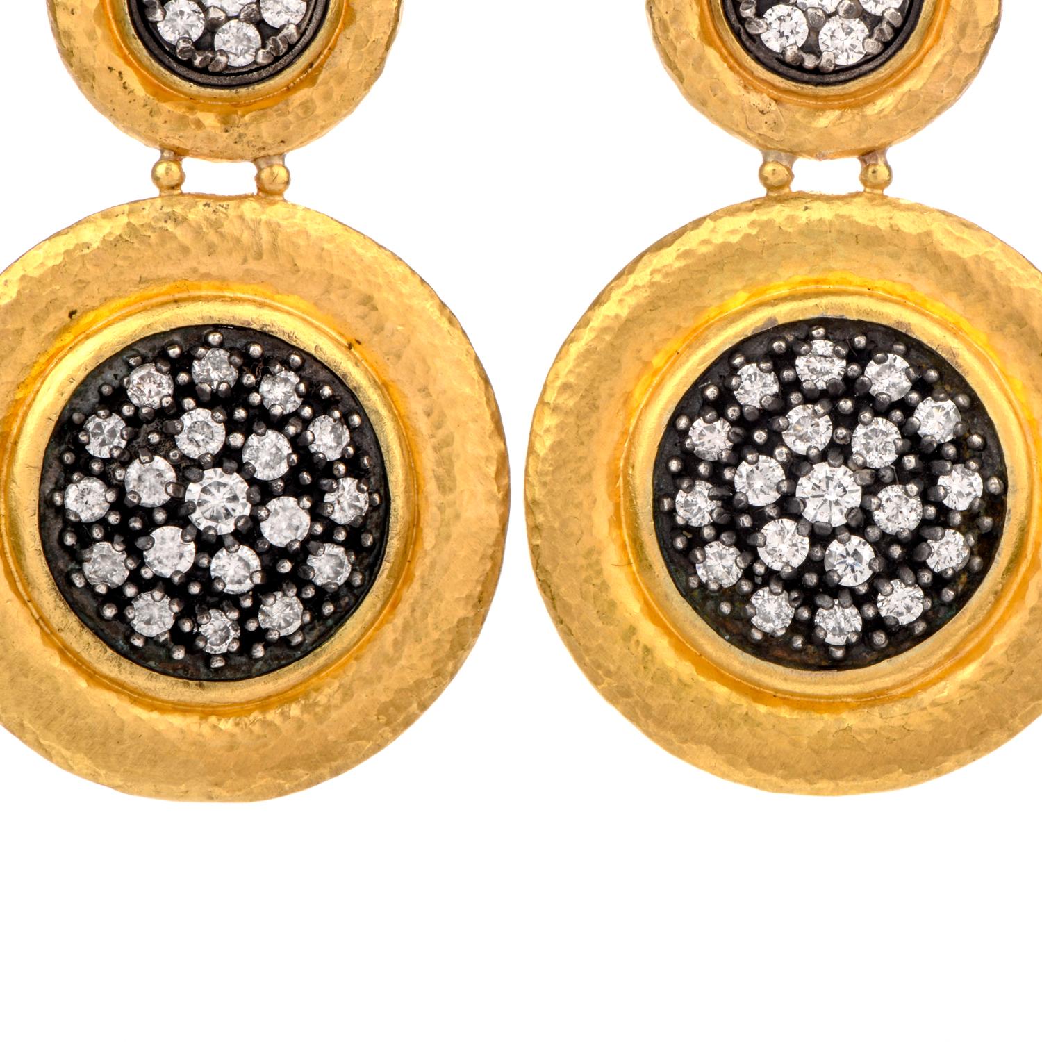 This visionary hand hammered earrings was created by Gurhan and 

crafted in pure 24 Karat gold.

A subtle hammered finish embellishes the surround while

round brilliant cut white diamonds lay amidst

a blackened silver .

Diamonds weigh