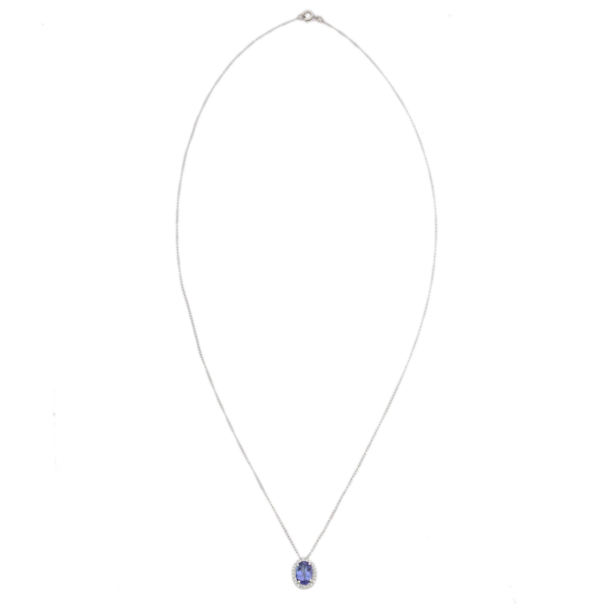 Everyday Halo Diamond Tanzanite Solitaire Necklace in 18K Gold with diamond studded around oval tanzanite. This stunning piece of jewelry instantly elevates a casual look or dressy outfit. 
Tanzanite brings energy, calmness and happiness into life.