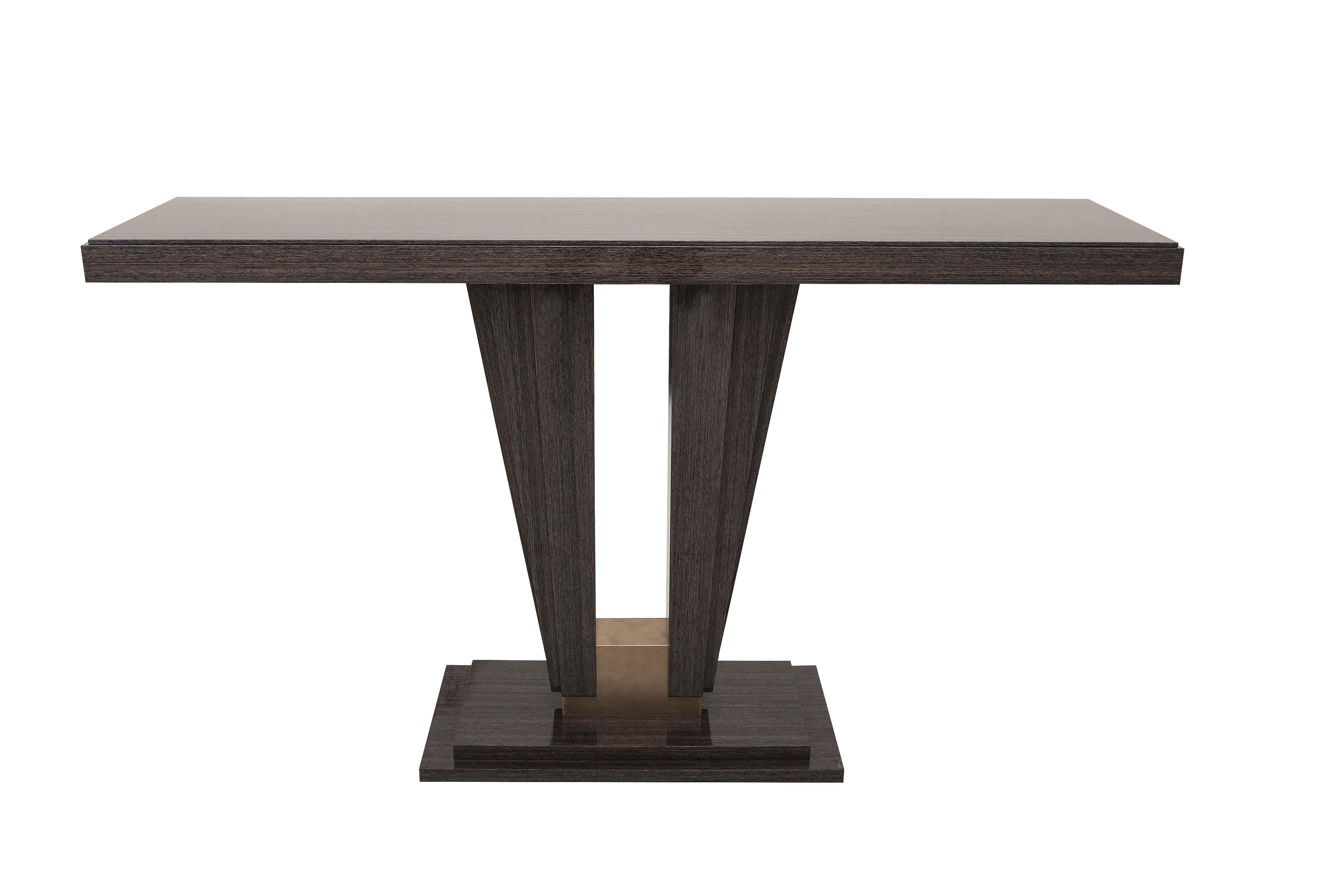 Elevate your space with this sleek and stylish console table. Featuring a rich dark wood finish and a distinctive V-shaped base accented with a metal insert, this piece perfectly blends elegance with contemporary design. Ideal for entryways, living