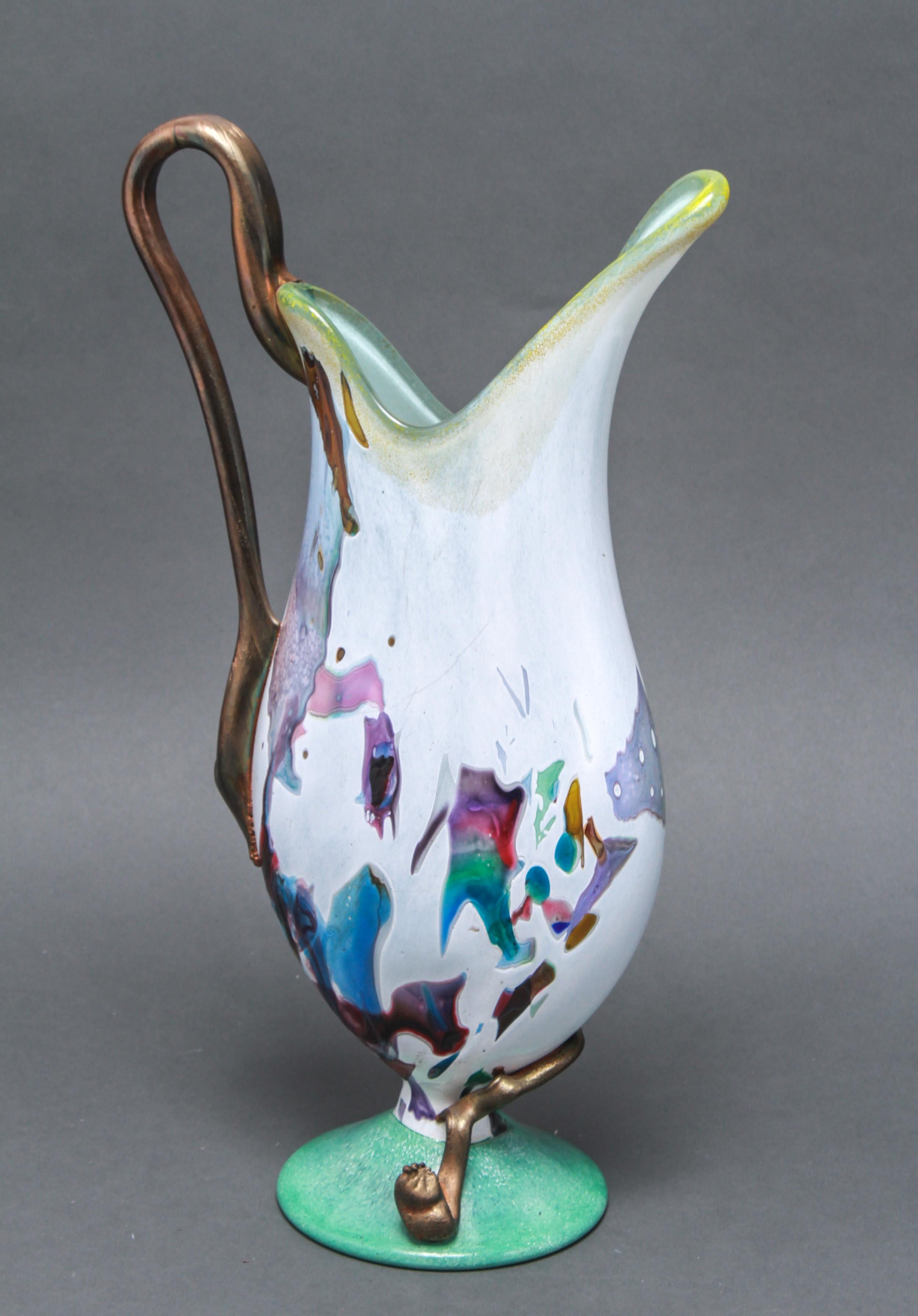 Modern hand blown glass pitcher or decorative ewer with an applied handle and a multicolored decorative motif. The piece was likely made during the late 20th century. In great vintage condition with age-appropriate wear.