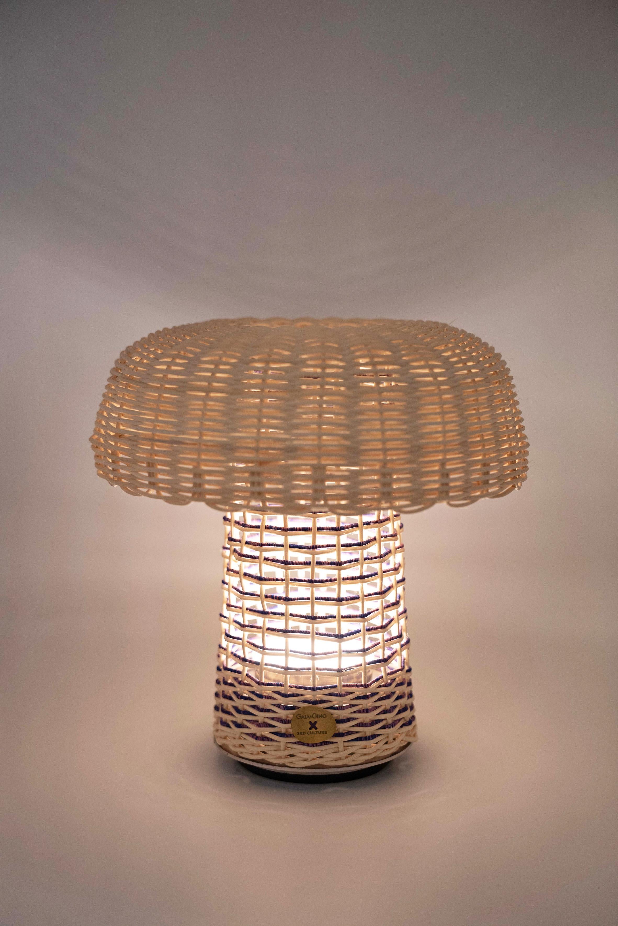 Fungi Cordless Portable Table Lamp is designed by Doganberk Demir  for GAIA&GINO x 3rd CULTURE and a part of the Wonderland Collection. 

The Fungi cordless table lamp innovatively twists traditional basket-making inside out creating a statement