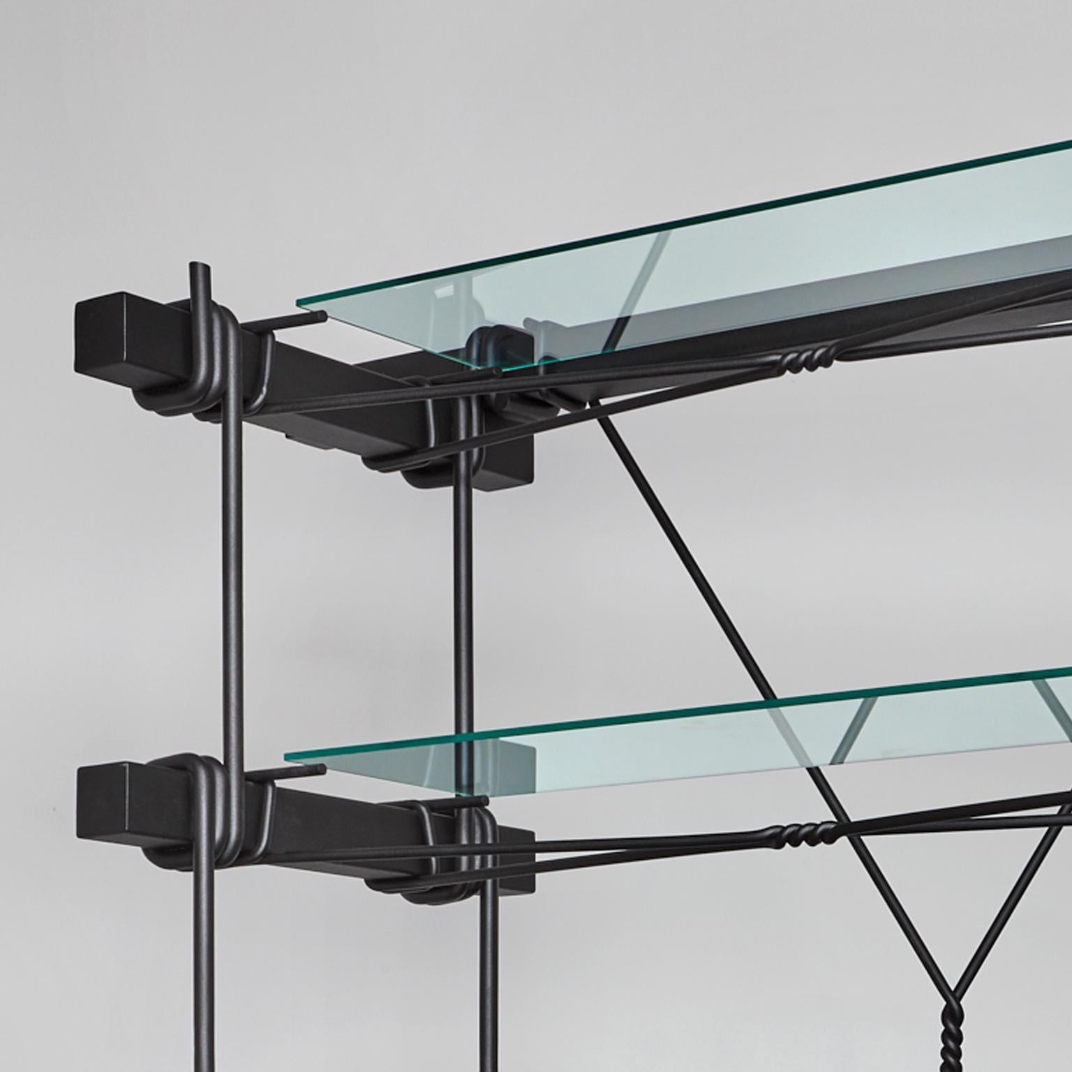 Hand forged cabinet with shelves designed with massive steel and glass top. Two Dutch designers, with different backgrounds yet with the same binding techniques, came together to create this Industrial-looking cabinet with shelves. While Tessa Koot