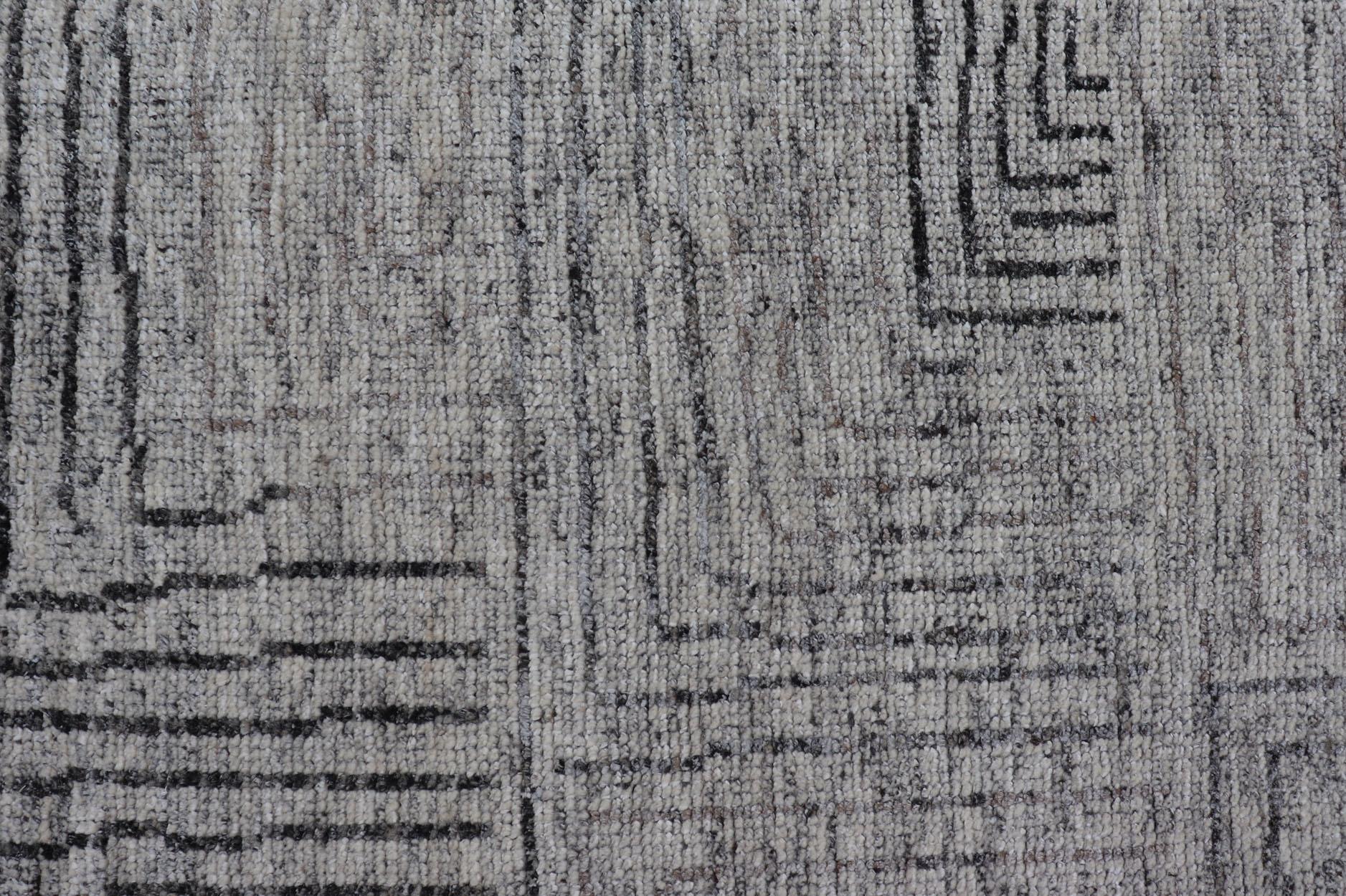 Measures 6 x 8'8 

This modern area rug features varying shades of gray in the field, blending neutrals into a near-homogenous color. The simple design vines all-over the field, rendered in a dark gray. 

Country of origin: India; Type: Modern,